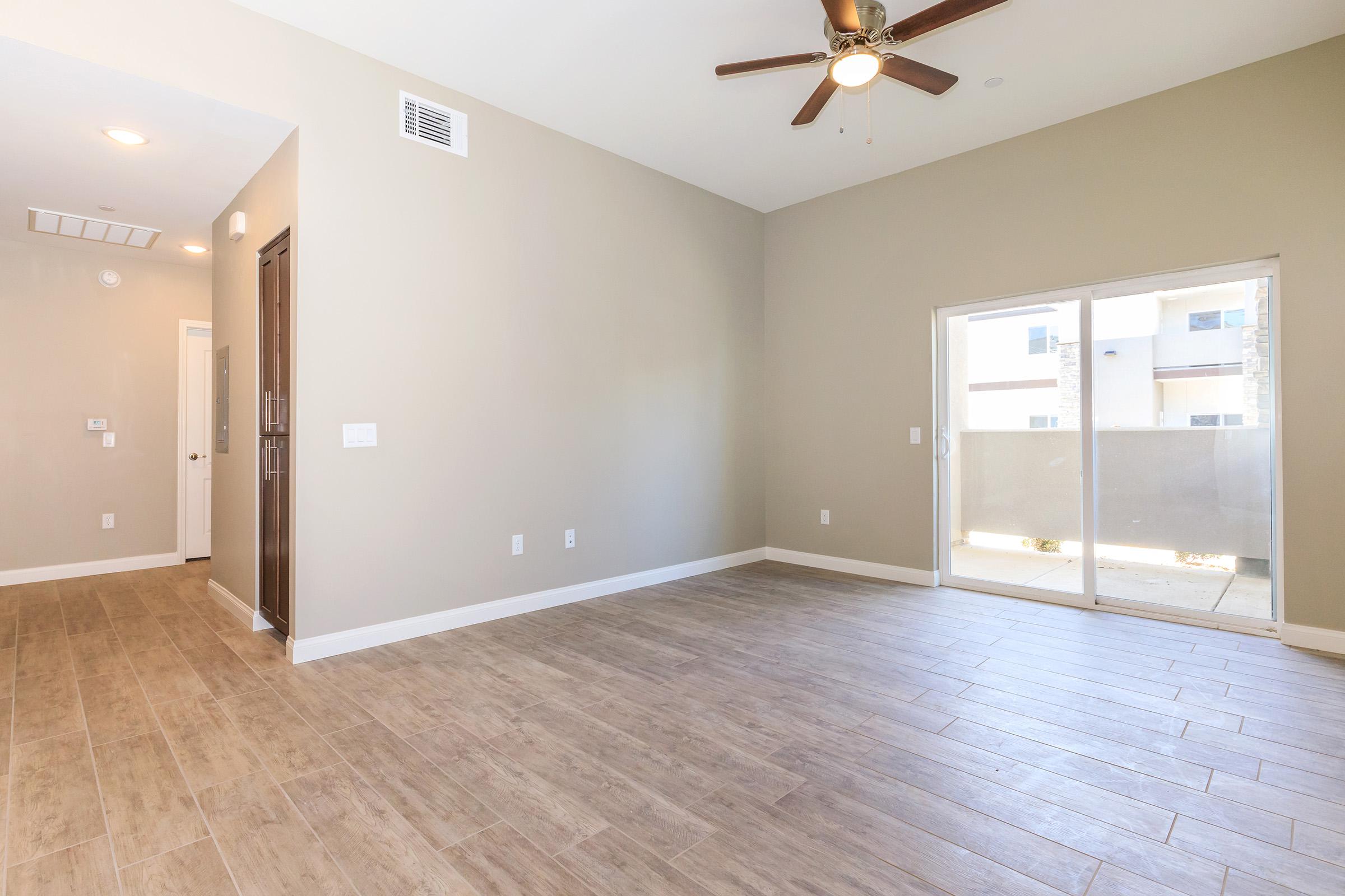 Vacant living room with sliding glass doors