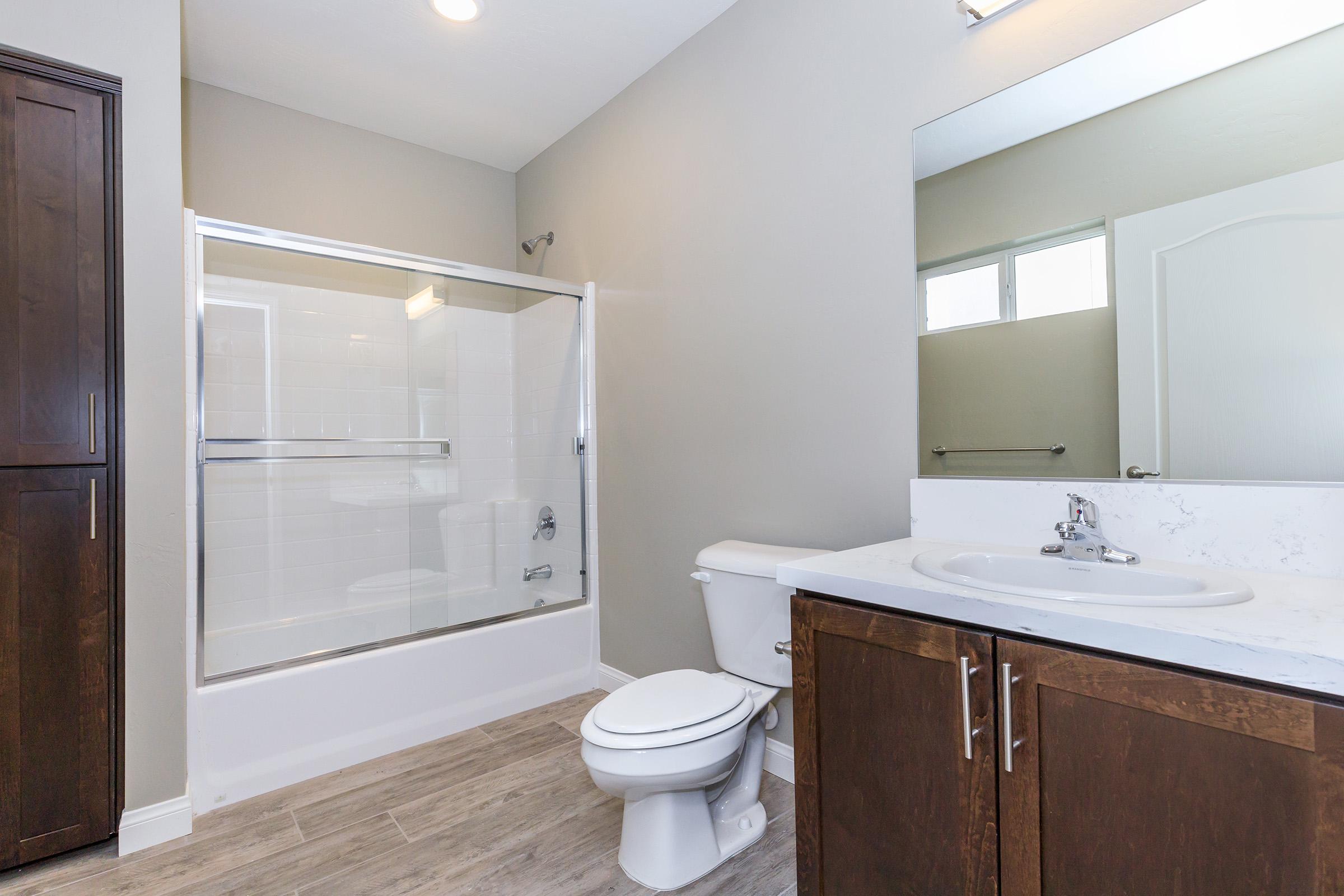 Vacant bathroom with wooden accents