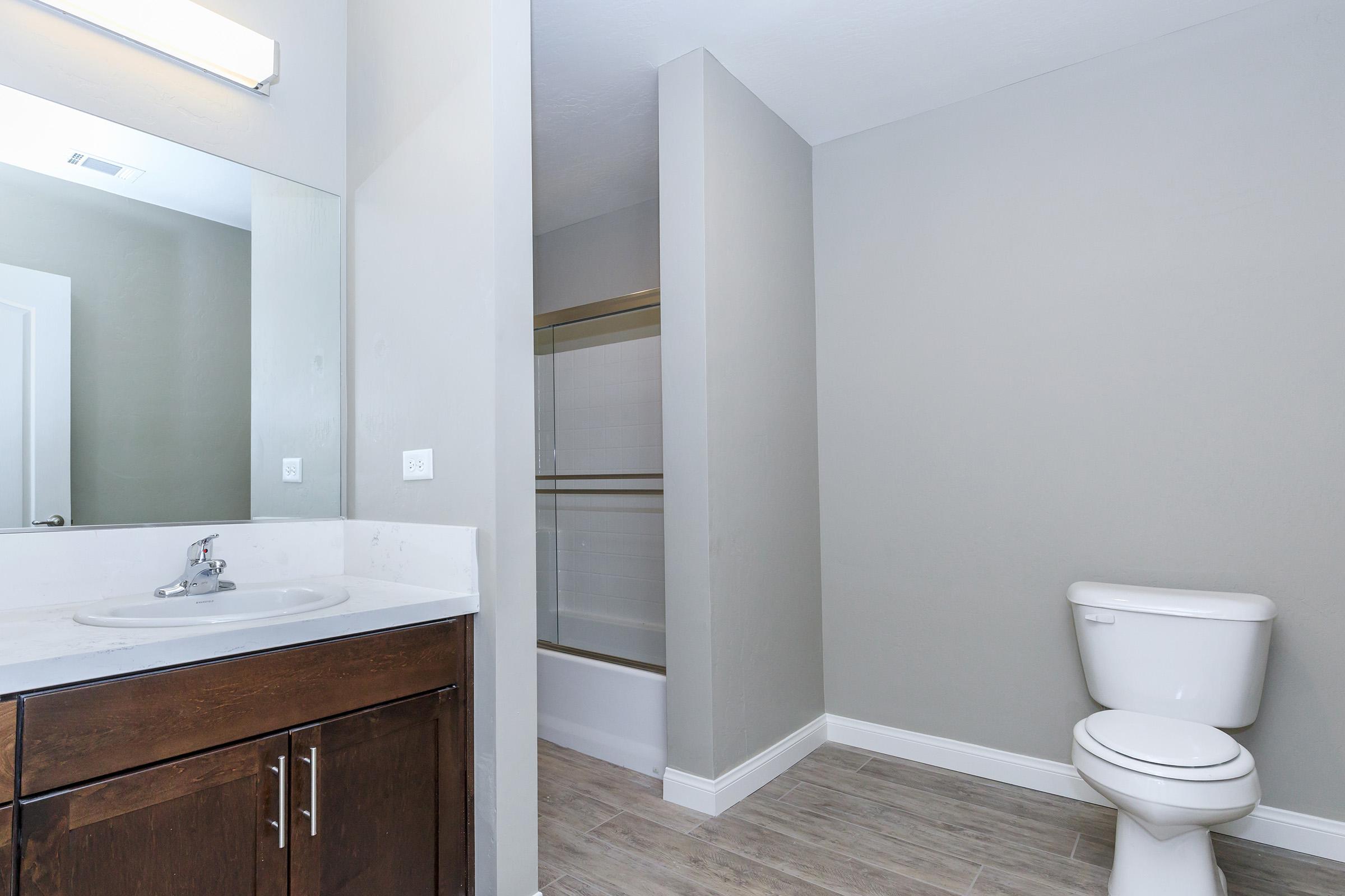 Unfurnished bathroom with wooden floors