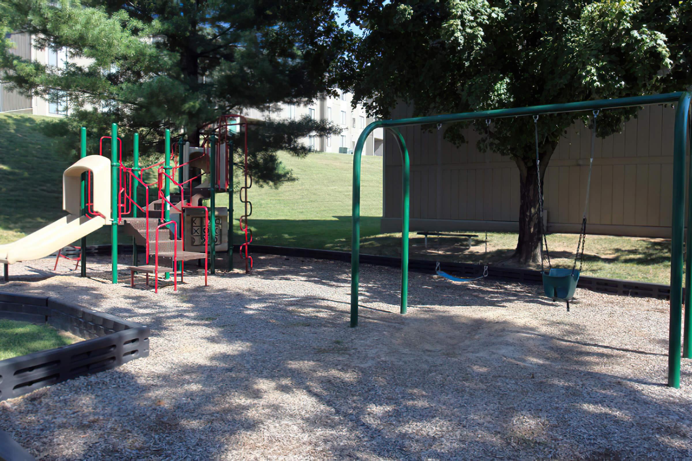 a playground with trees in the background