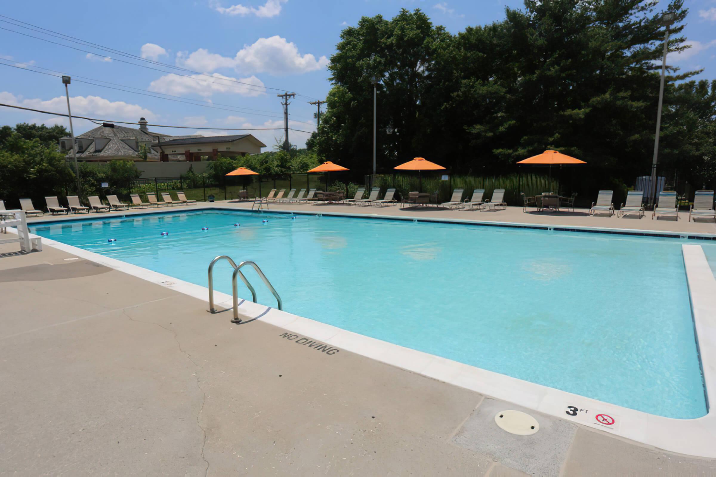 a pool next to a body of water