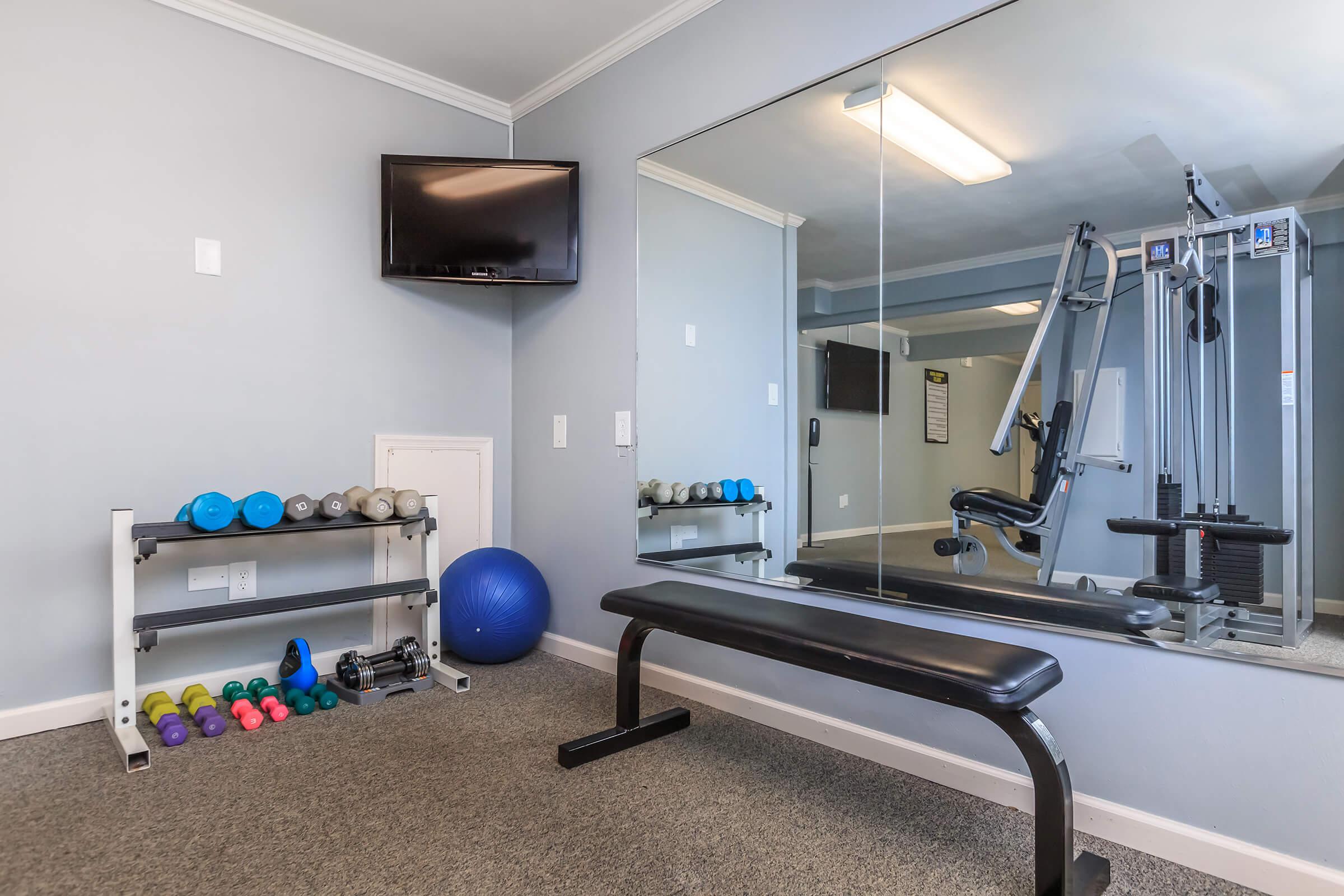 a bedroom with a large mirror