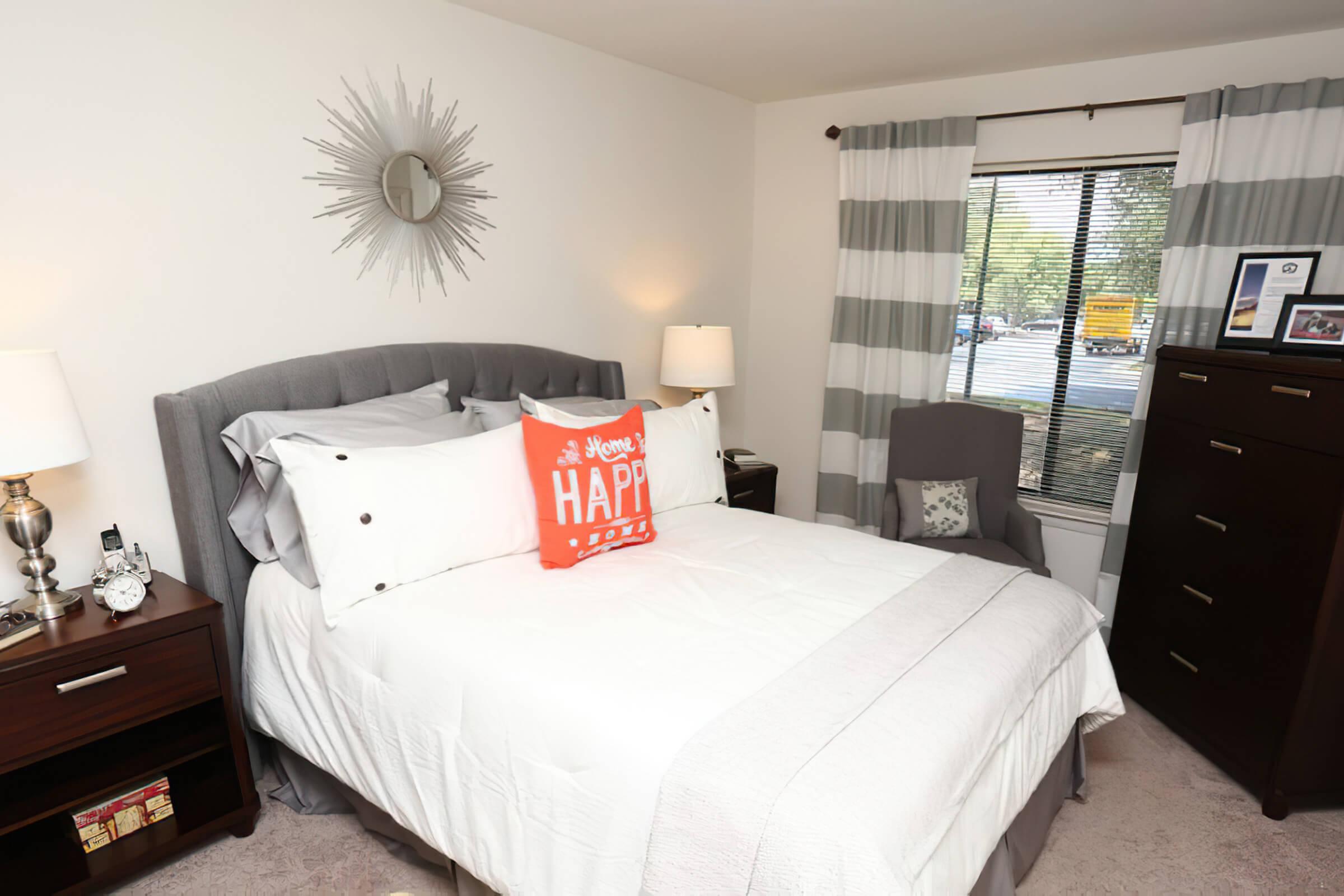 a bedroom with a large bed in a hotel room