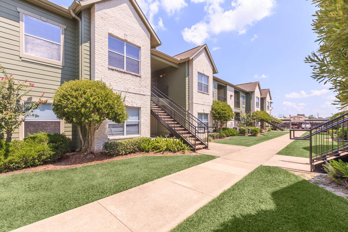 Staircase view of The Avenue apartments for rent with large windows and spacious balconies