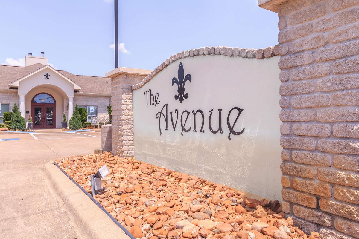 Entrance sign to The Avenue apartments in Nederland, TX