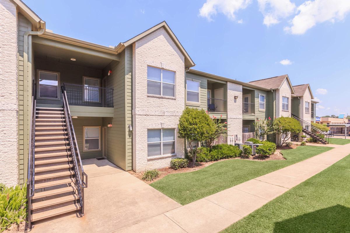 Exterior view of The Avenue apartment buildings and landscaping