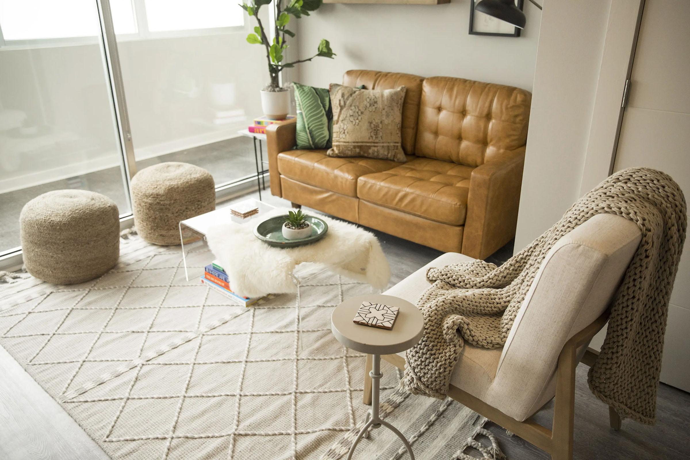 a living room with a couch and a chair