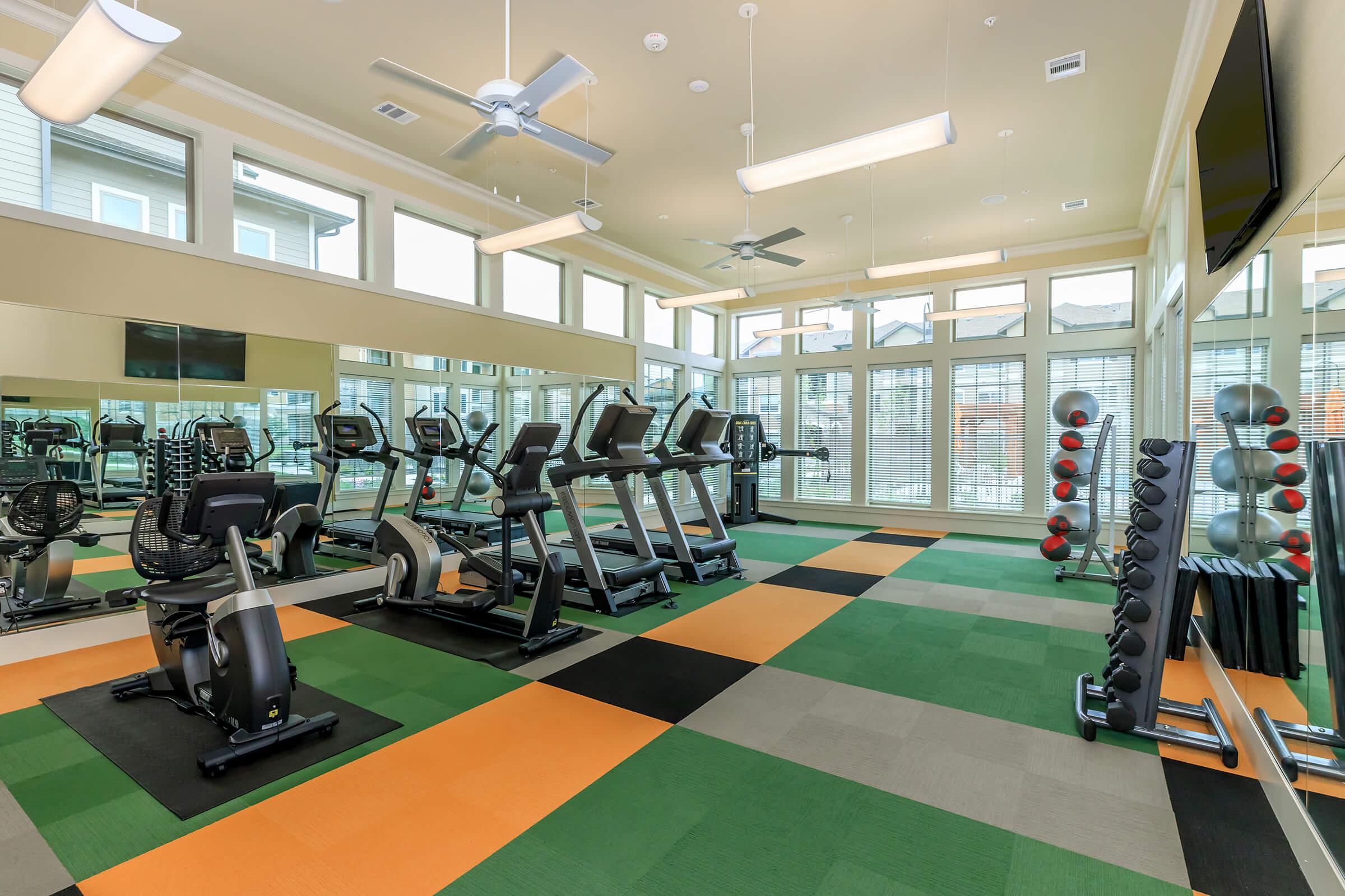 alt="fitness center and gym in Princenton, TX at Cypress Creek at Hazelwood Street Apartment Homes"