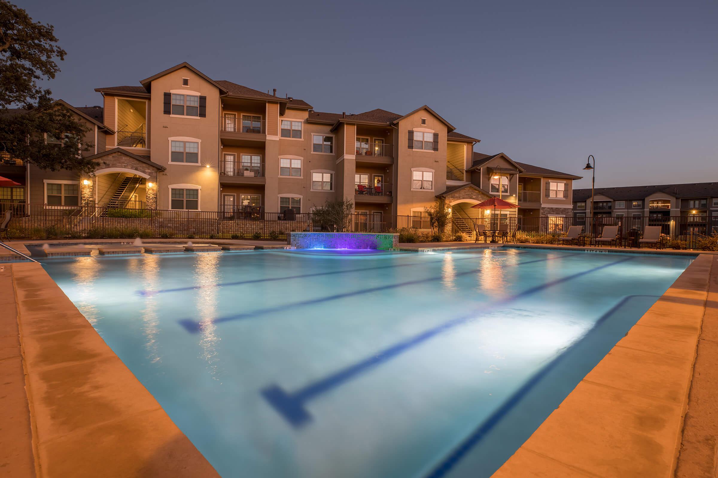alt="swimming pool at night in Princenton, TX at Cypress Creek at Hazelwood Street"