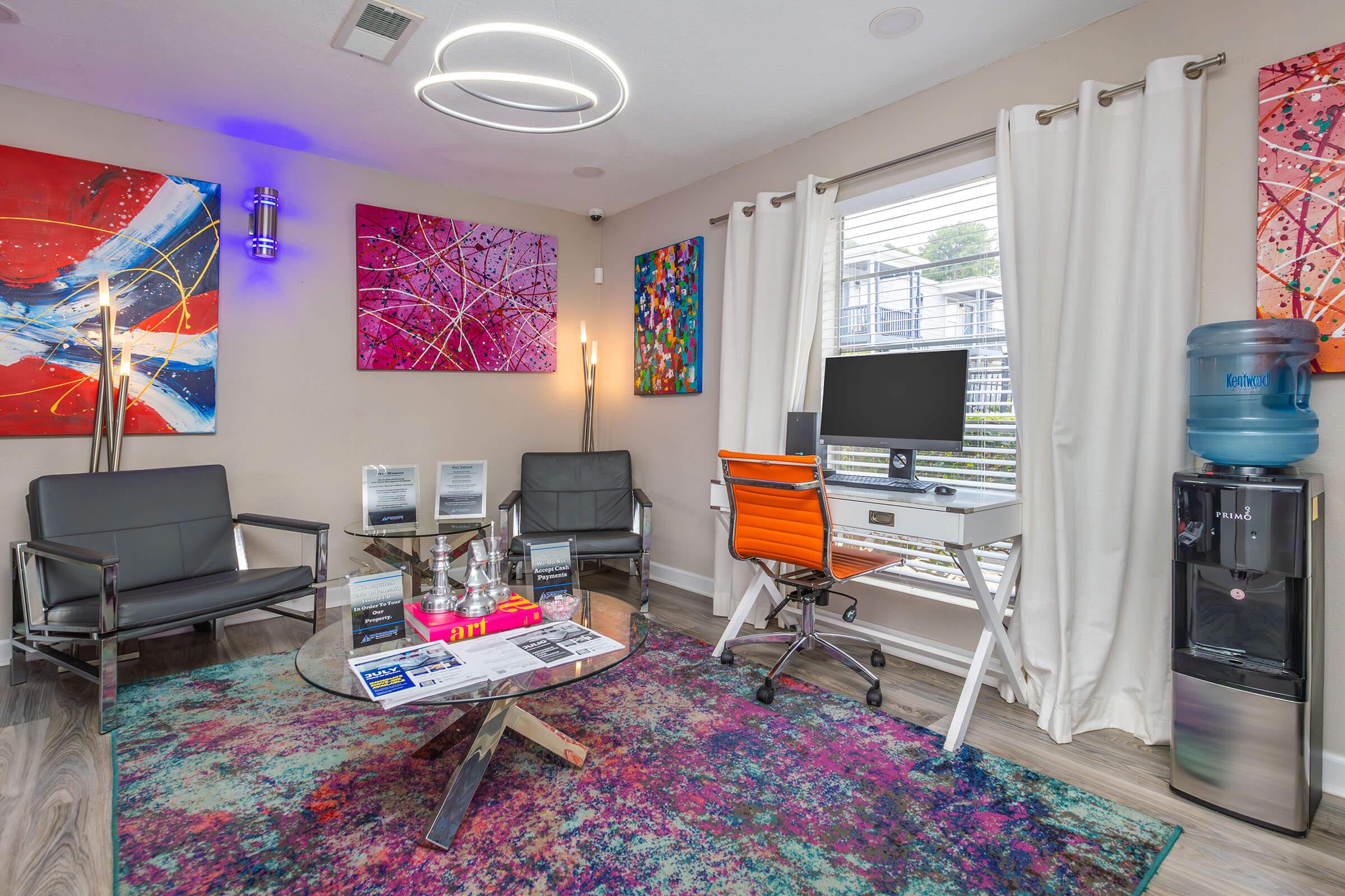 a living room filled with furniture and a rug