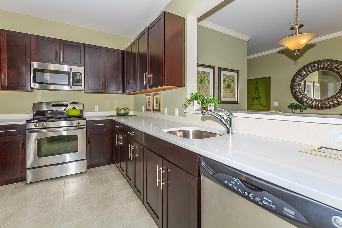 a kitchen with a stove and a sink