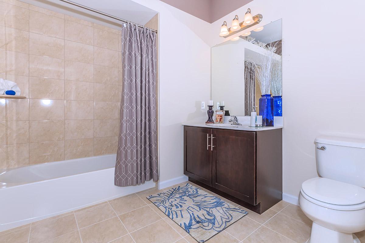 a large white tub next to a sink