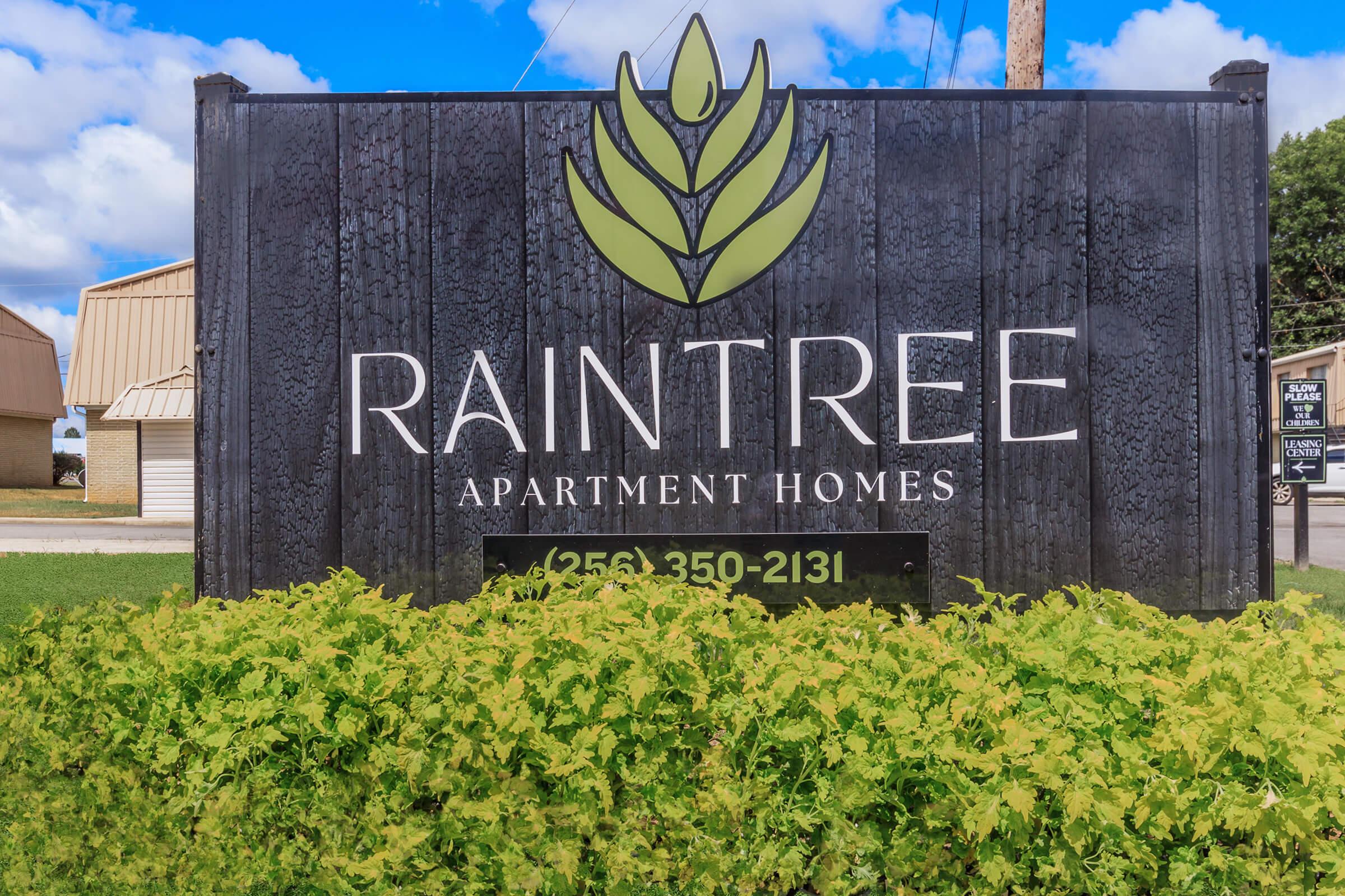 a sign in front of a building