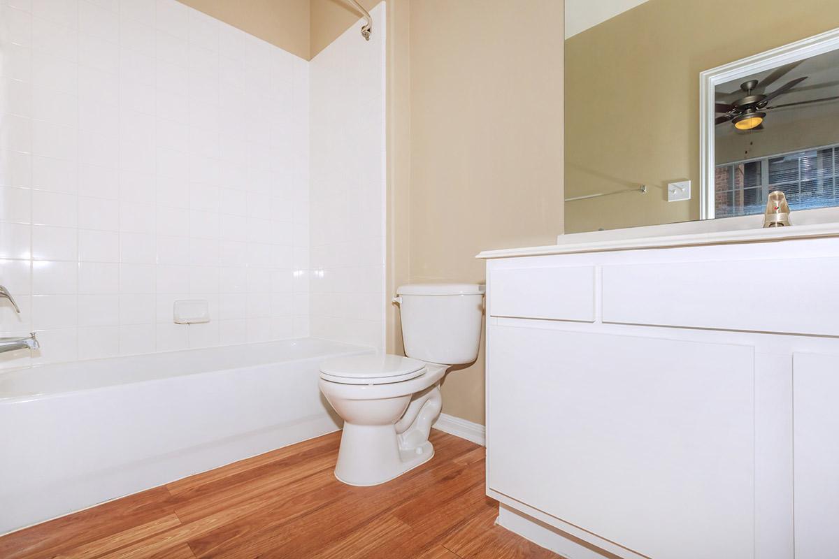 a large white tub sitting next to a sink