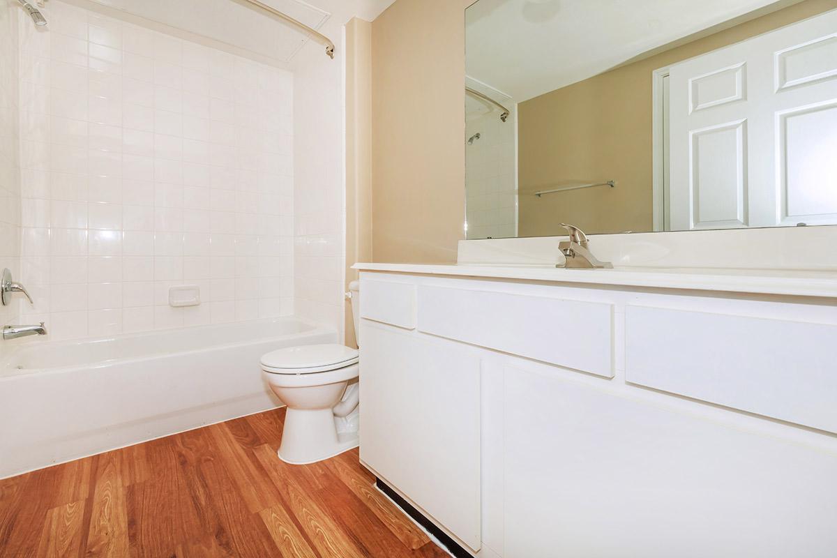 a large white tub next to a window
