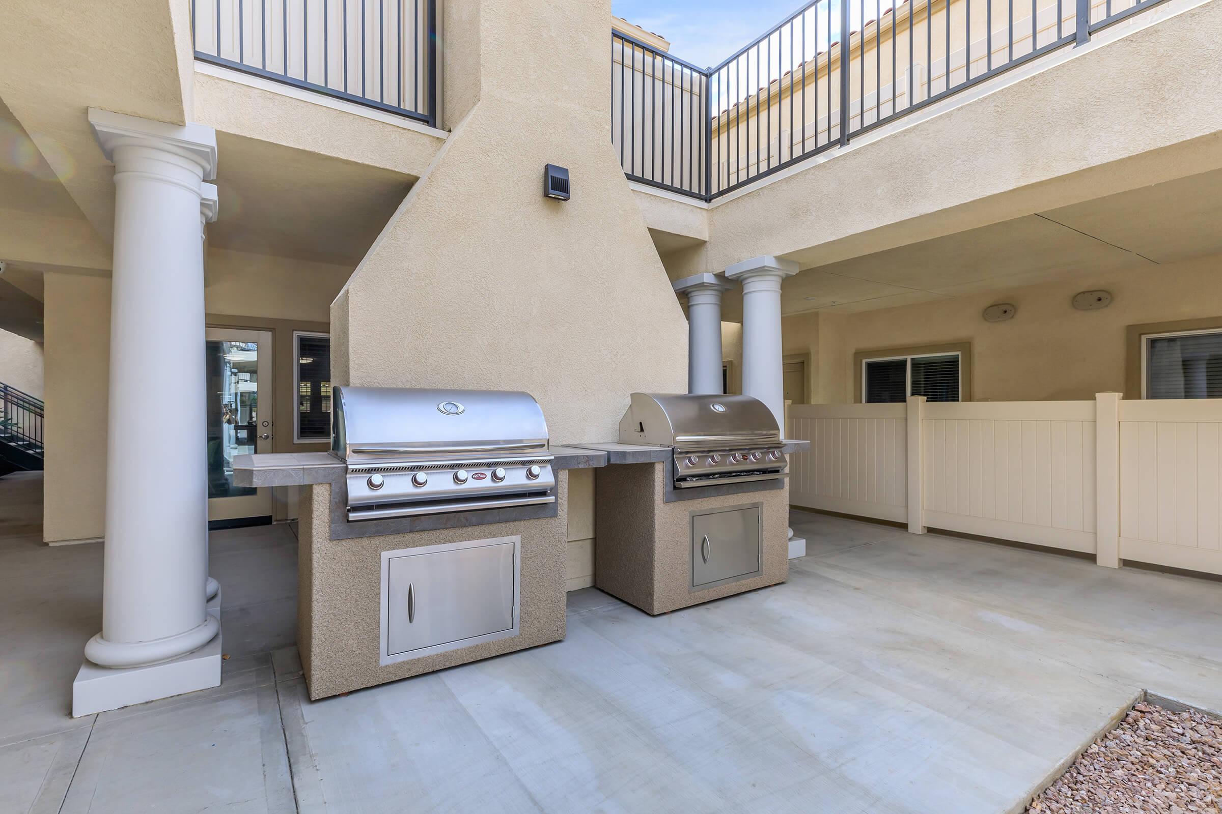 a kitchen with a stove top oven sitting inside of a building