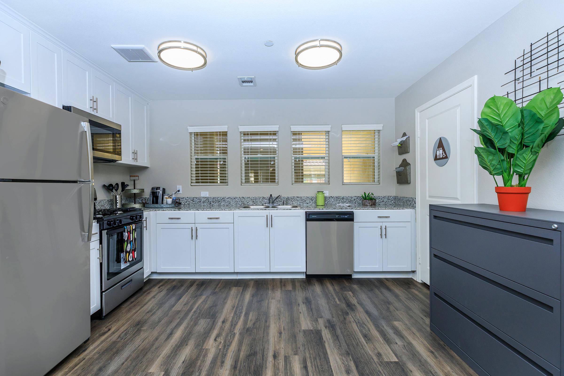 a kitchen with a building in the background