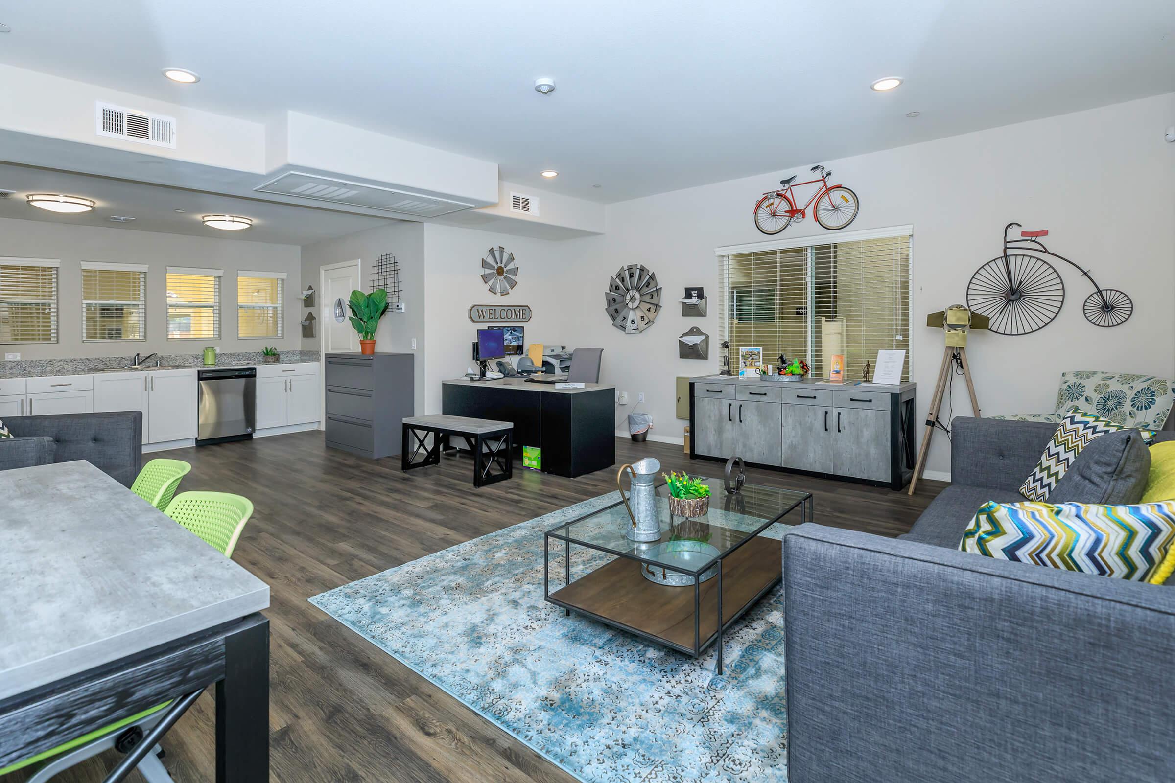 a living room filled with furniture and a table