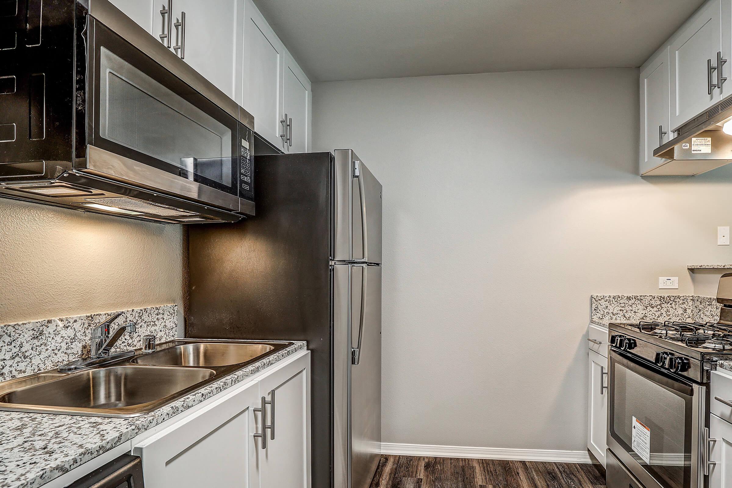 a kitchen with a stove and a sink