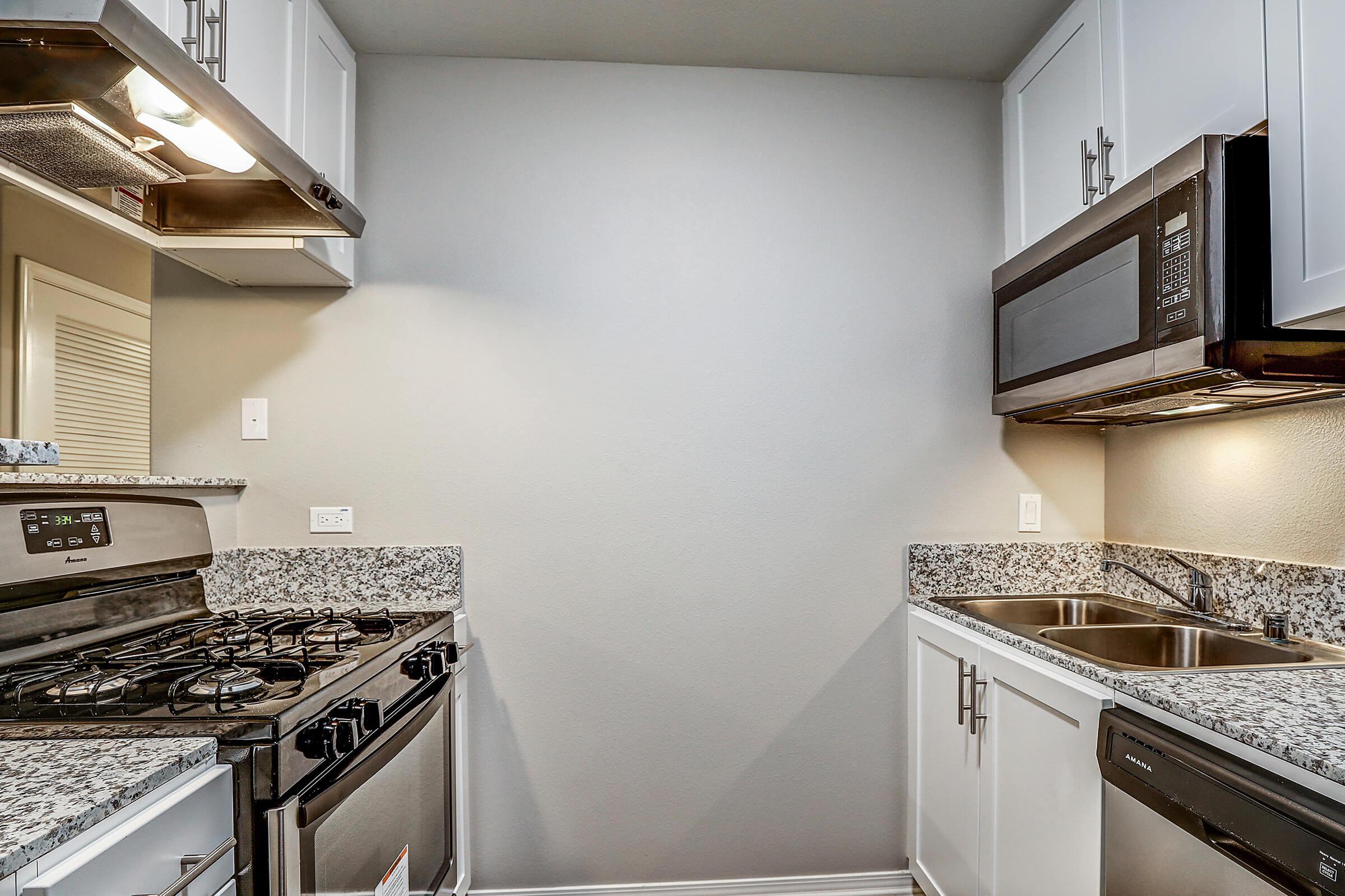 a kitchen with a stove top oven