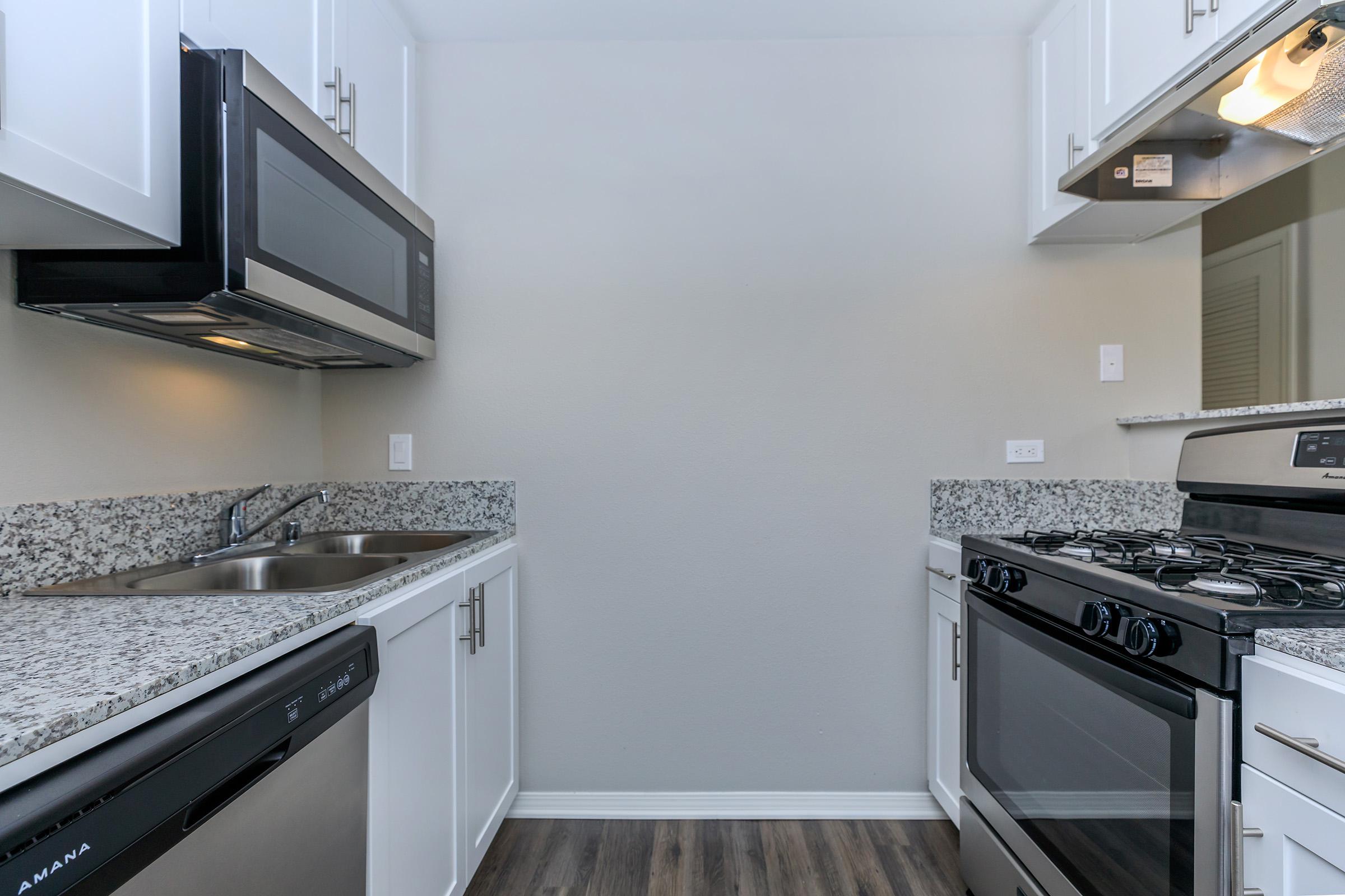 a kitchen with a stove top oven