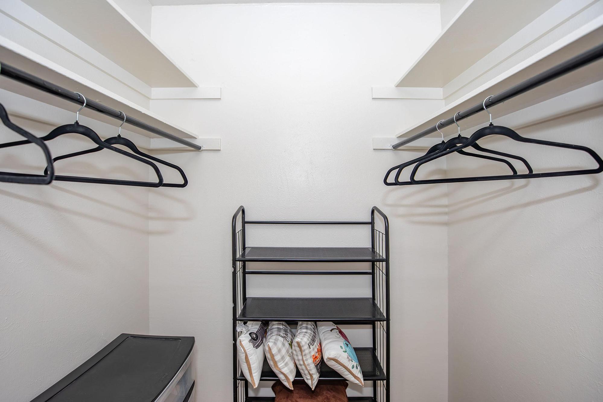 a bedroom with a bed and a mirror