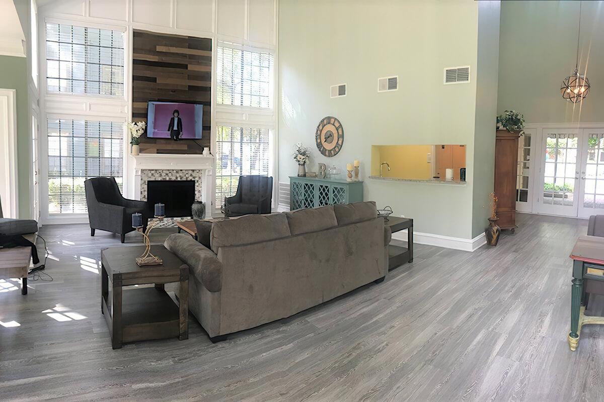 a living room filled with furniture and a fireplace