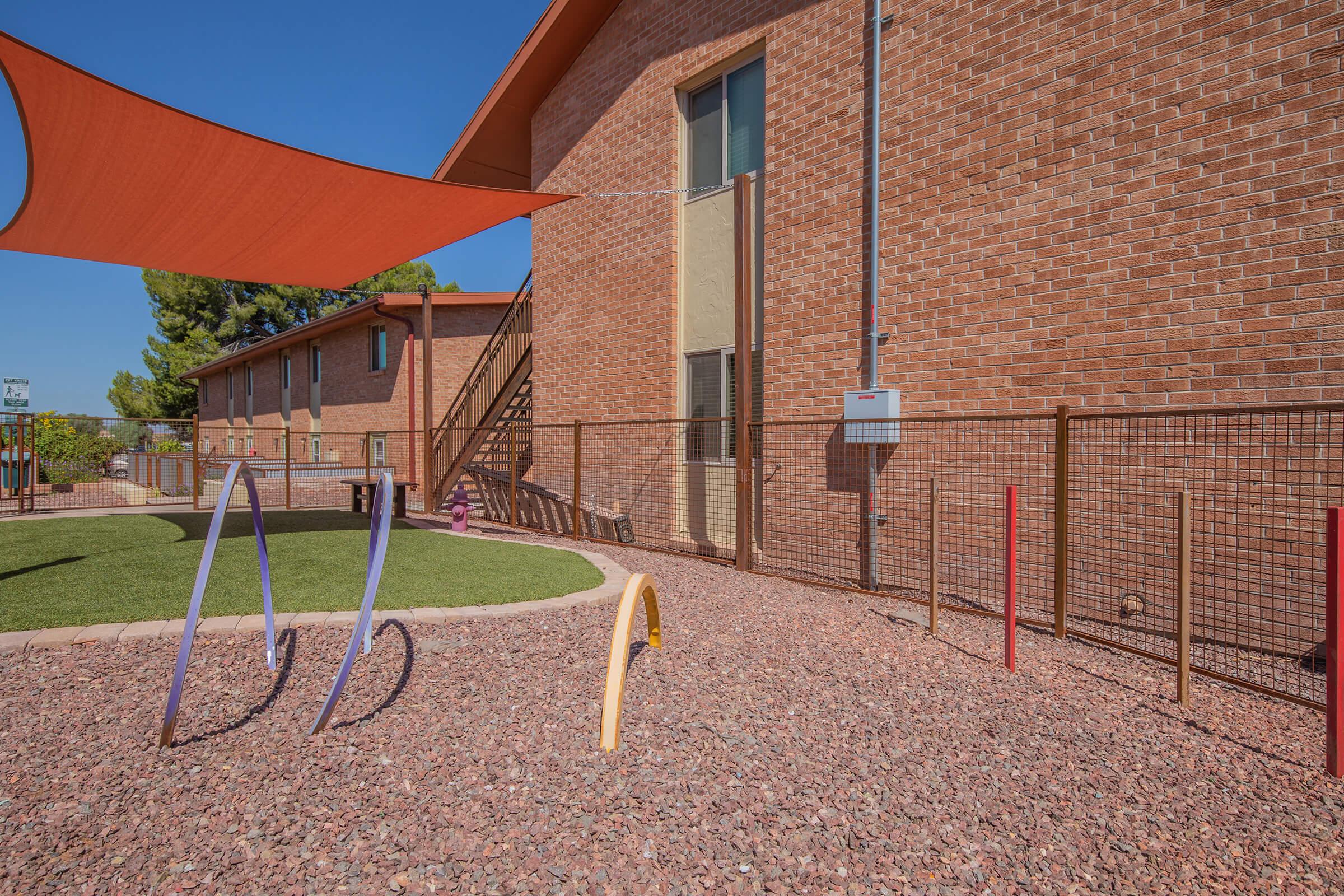 a large brick building with a kite