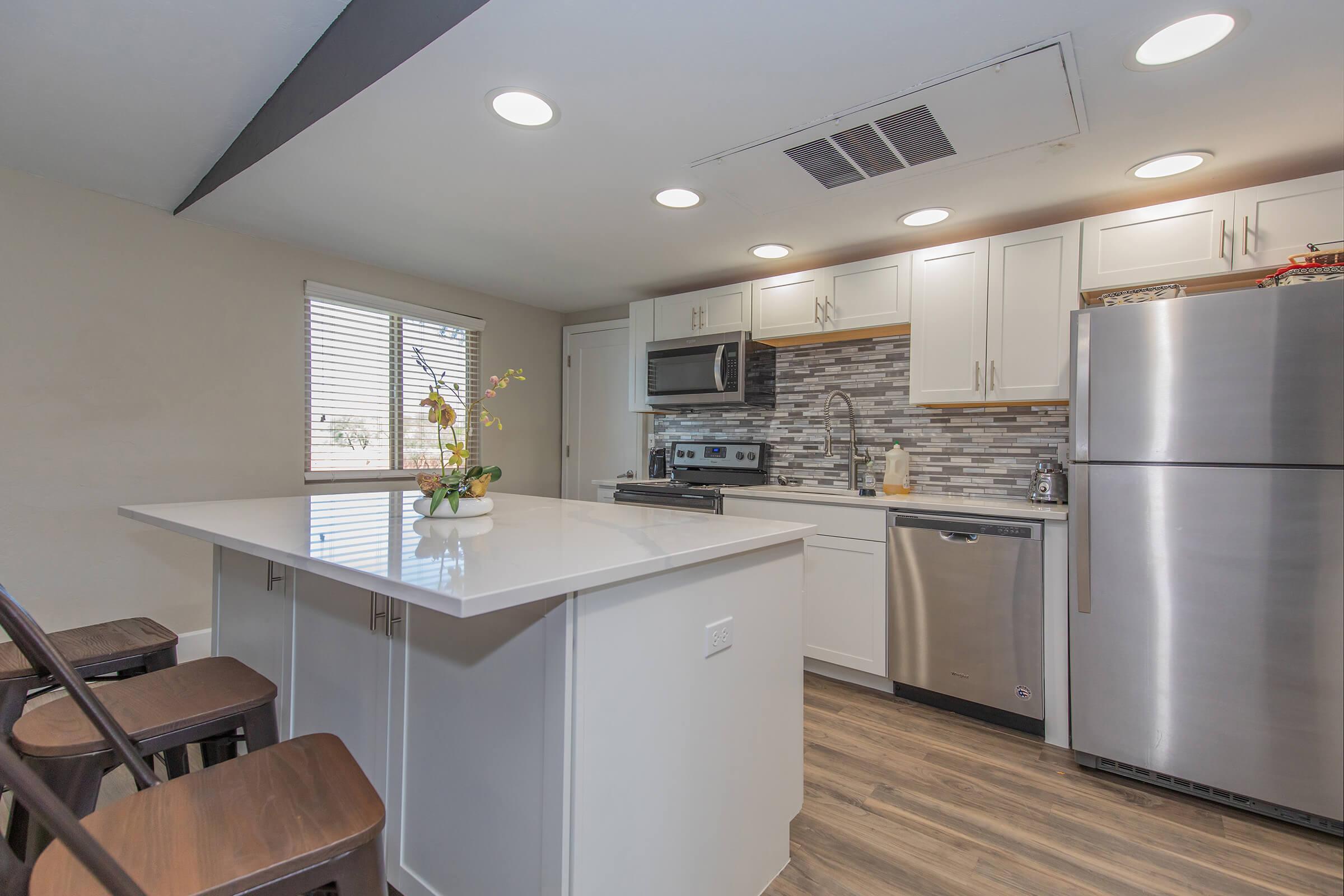 a kitchen with a table in a room