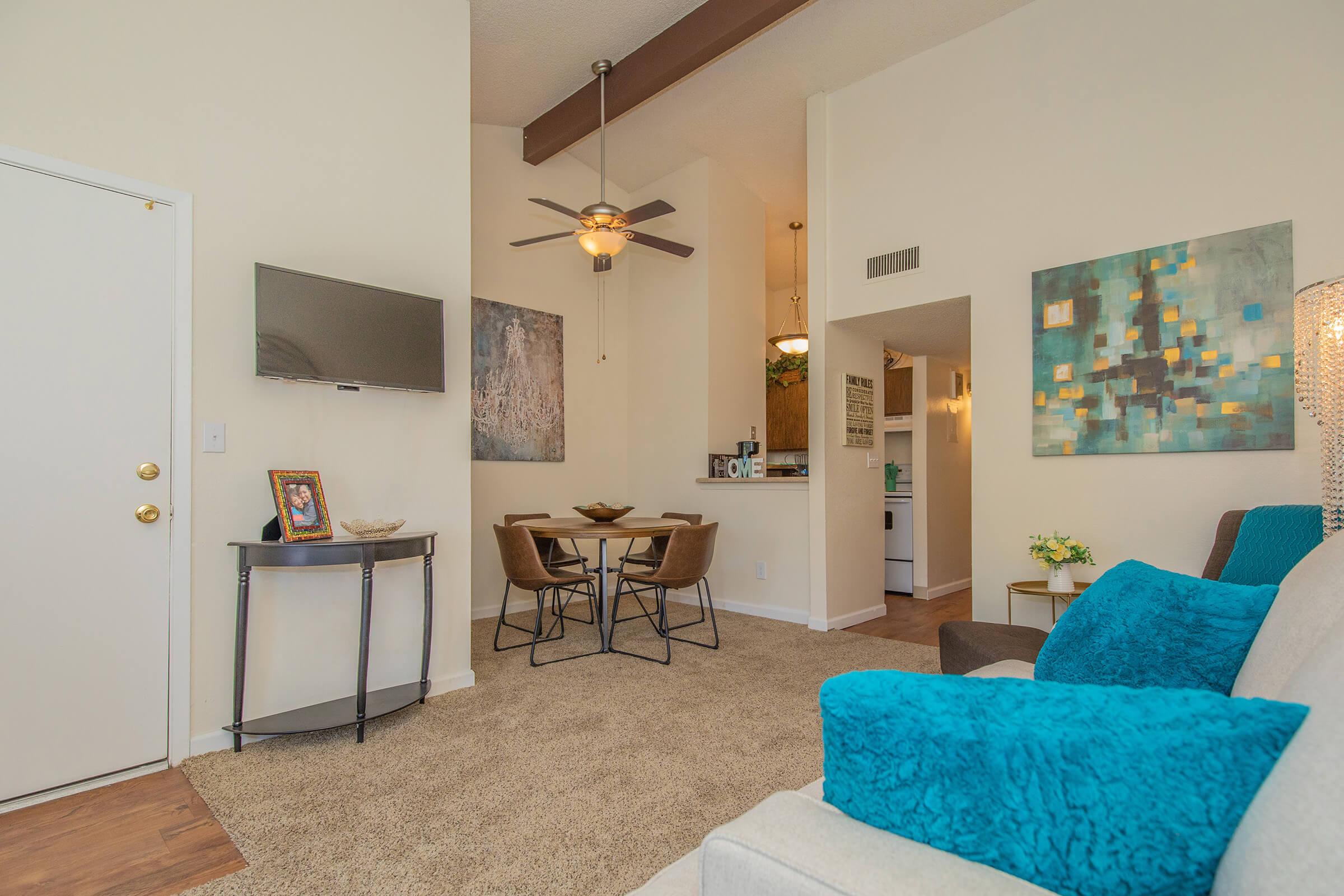 a living room filled with furniture and a table