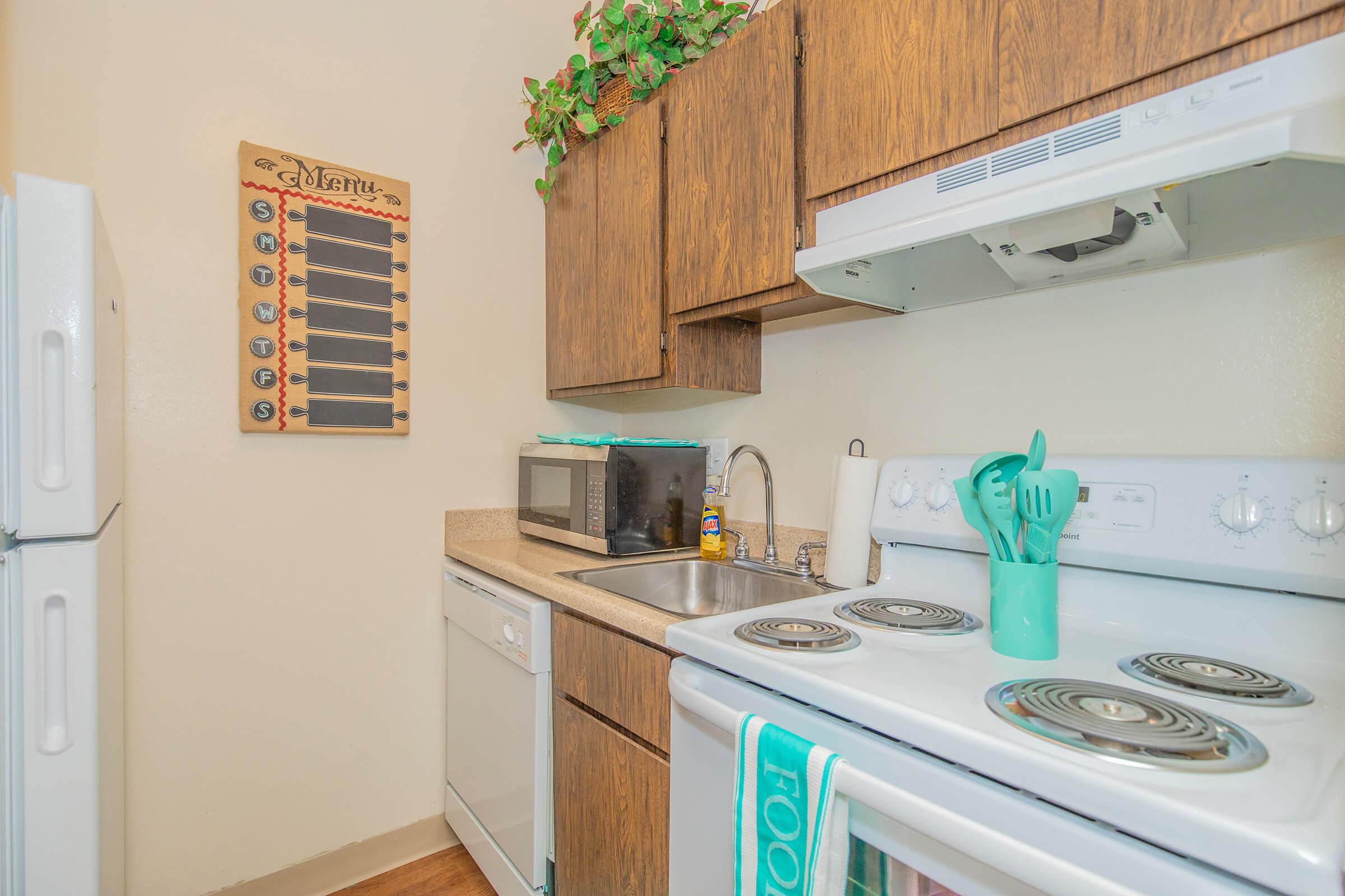 a kitchen with a stove top oven sitting inside of a refrigerator