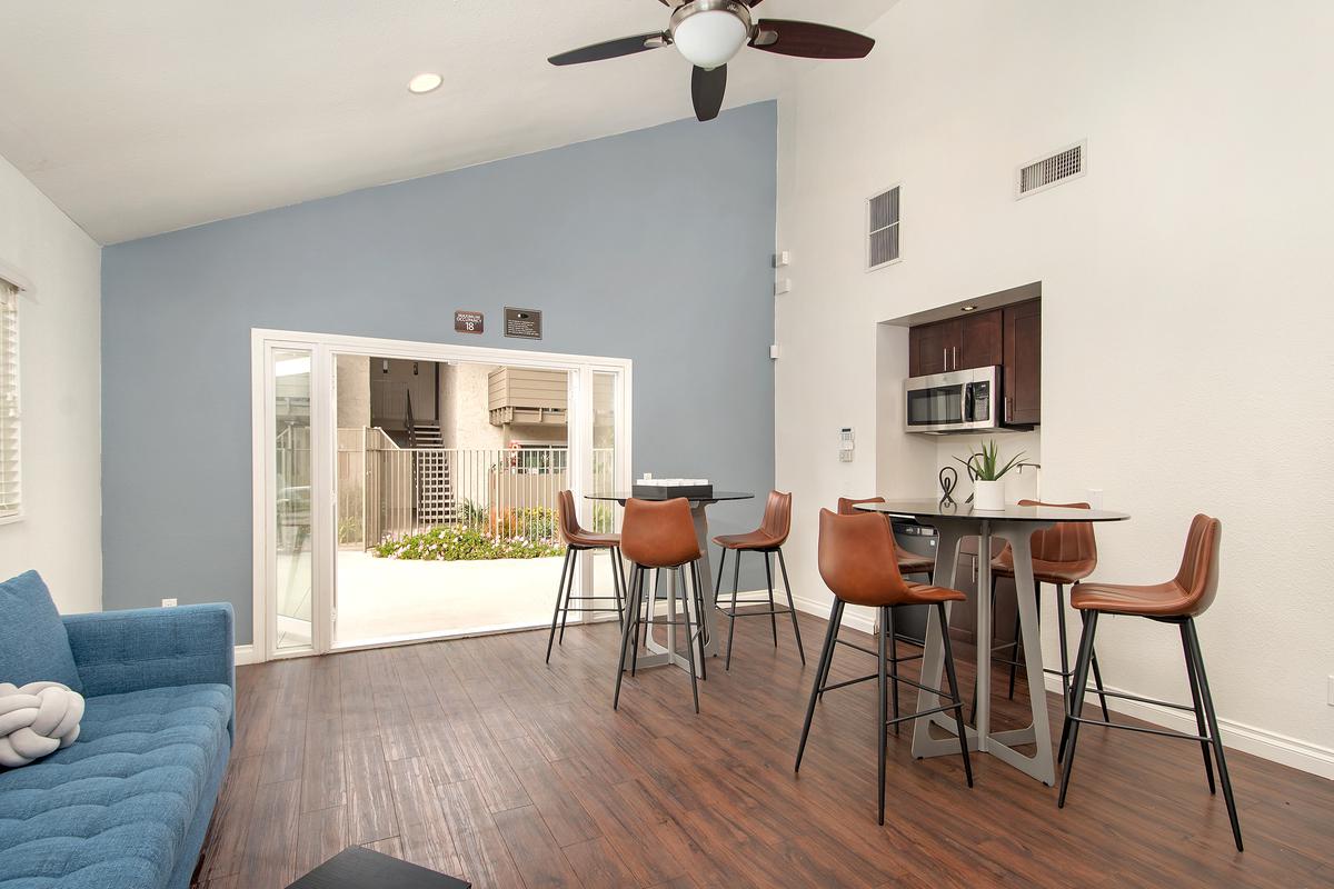 a living room filled with furniture and a table