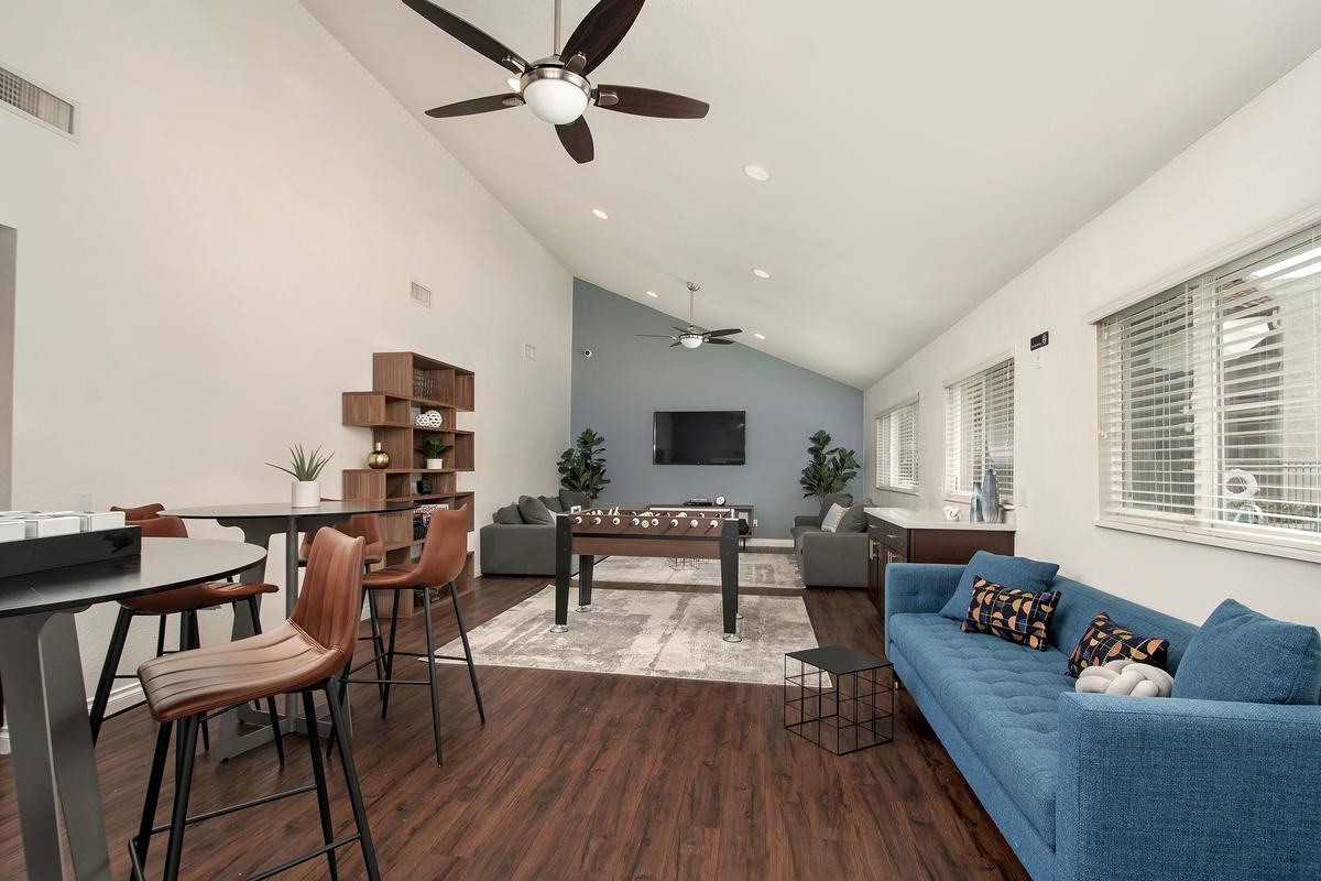 a living room filled with furniture and a large window