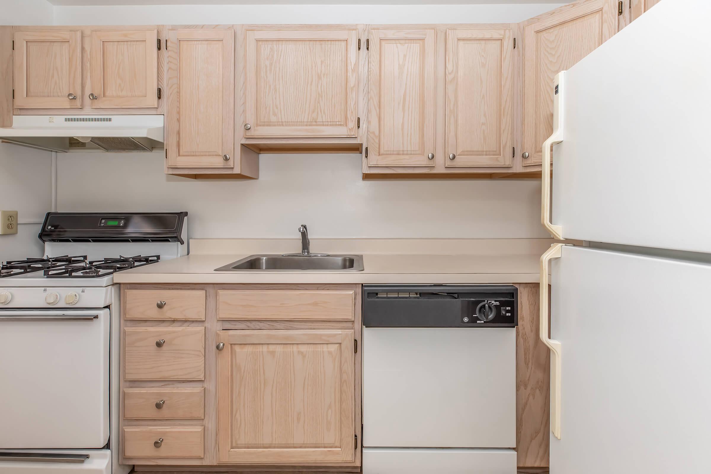 a kitchen with a stove top oven sitting inside of a refrigerator