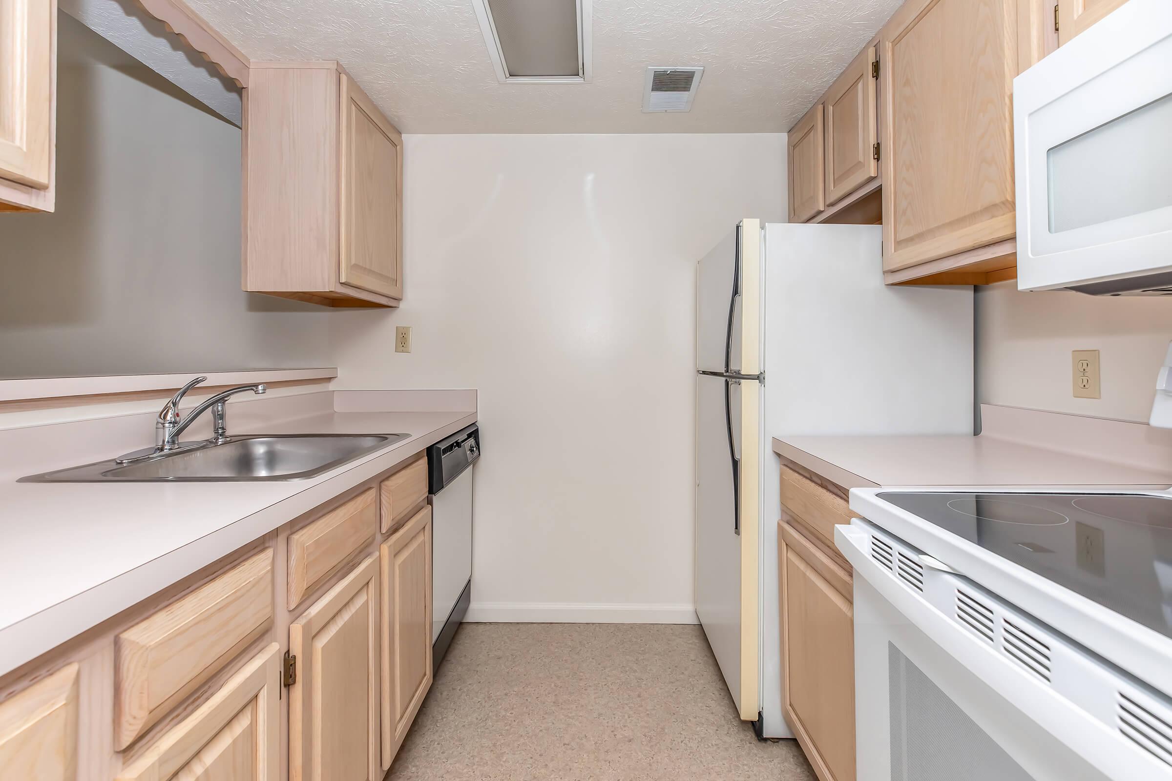 a kitchen with a stove and a refrigerator