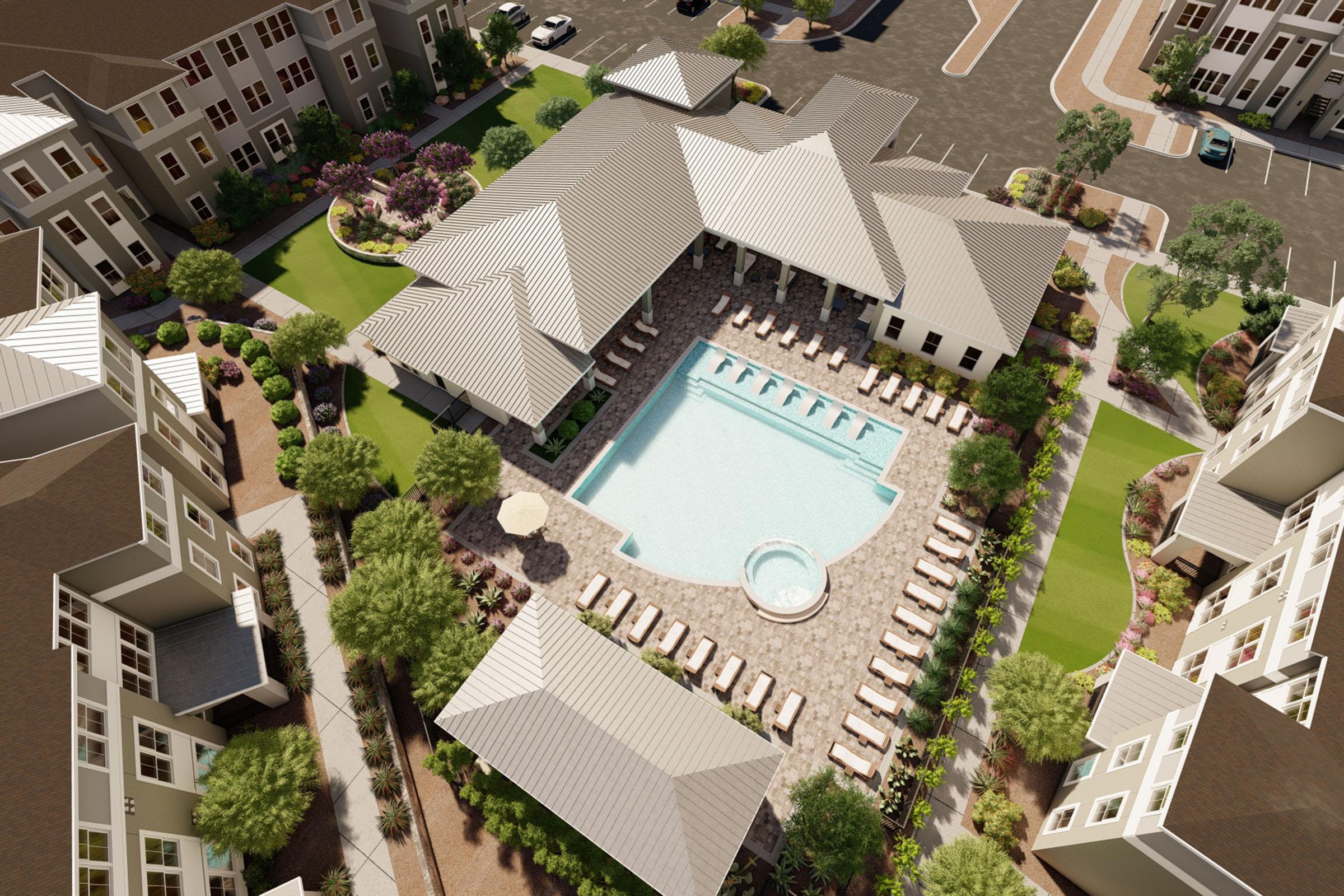 Aerial view of a modern residential complex featuring a spacious swimming pool surrounded by lounge chairs, landscaped gardens, and nearby apartment buildings. The design includes shaded areas and pathways, showcasing a community atmosphere with ample outdoor space for relaxation and social activities.