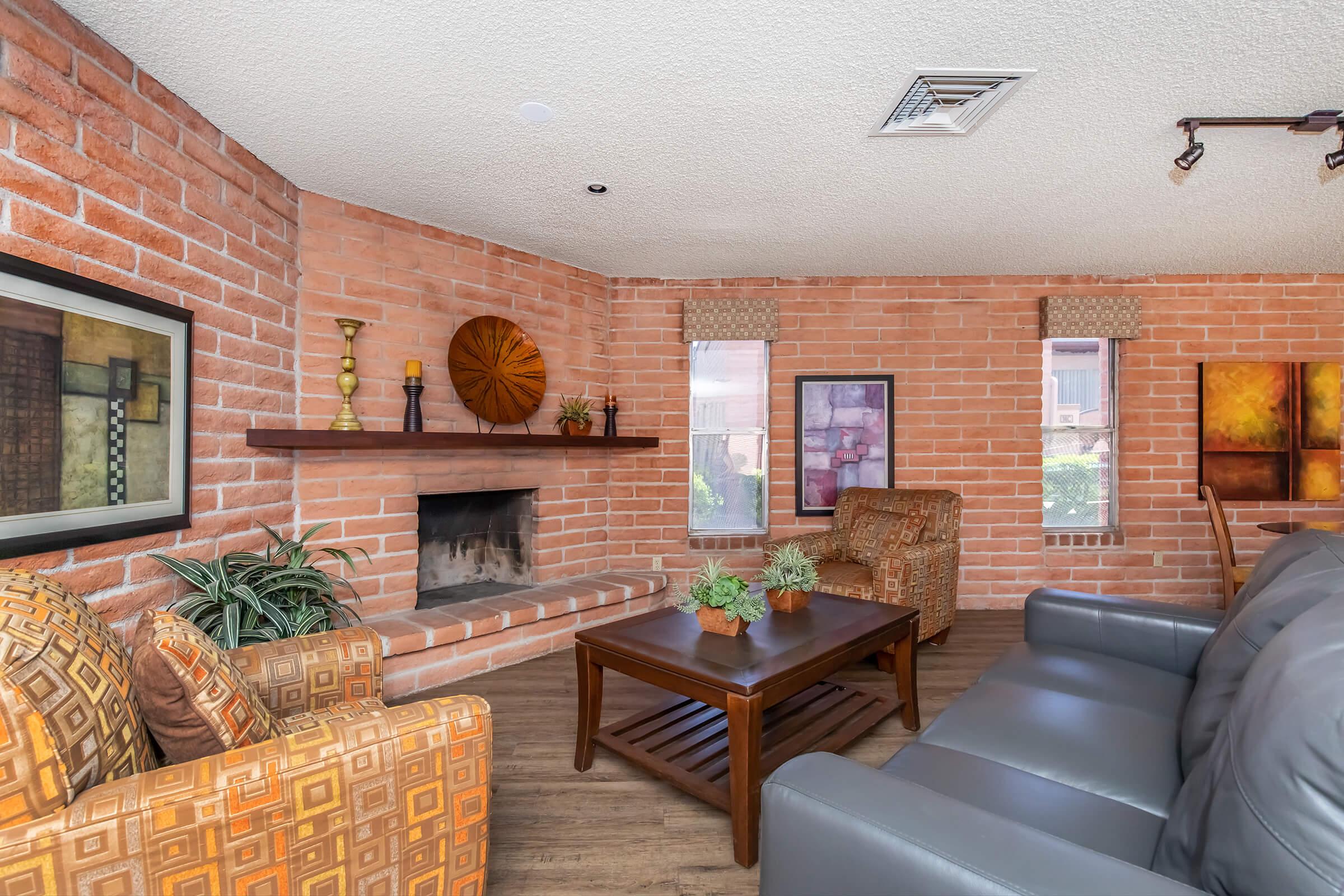 a living room filled with furniture and a fire place