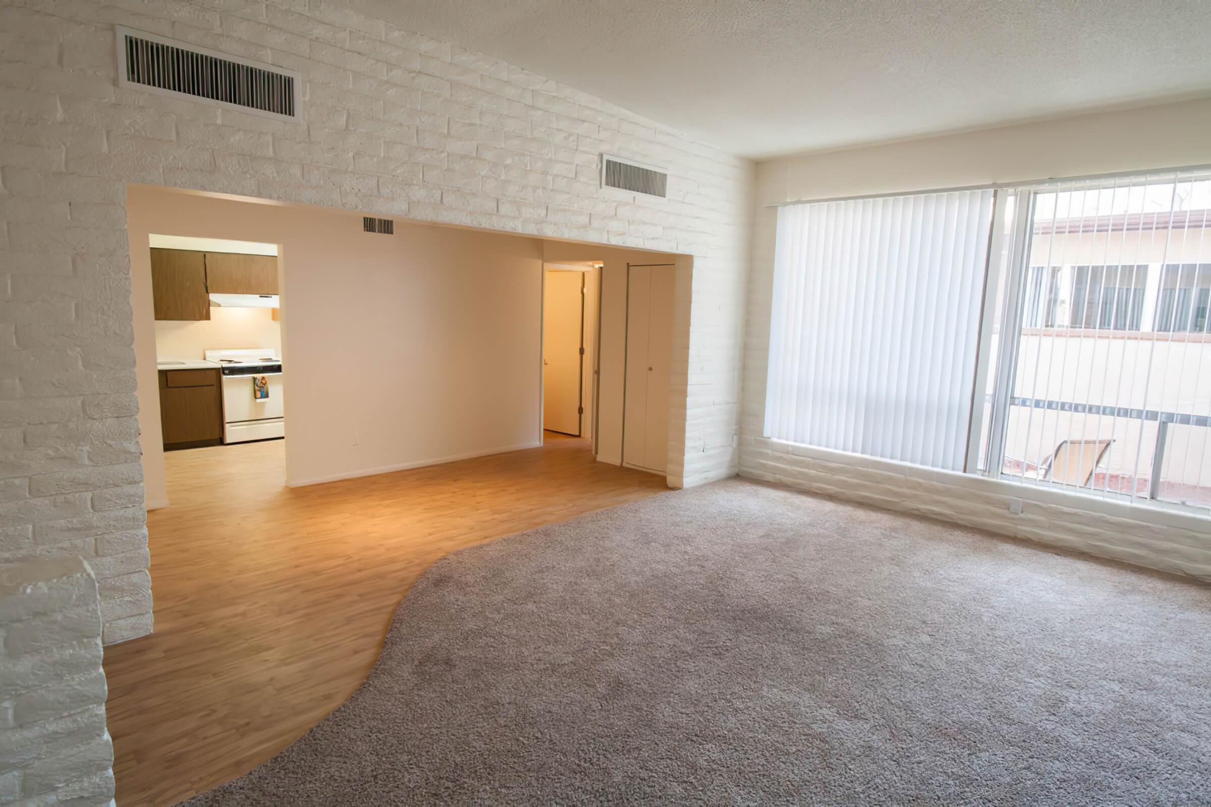 a large empty room with a wooden floor