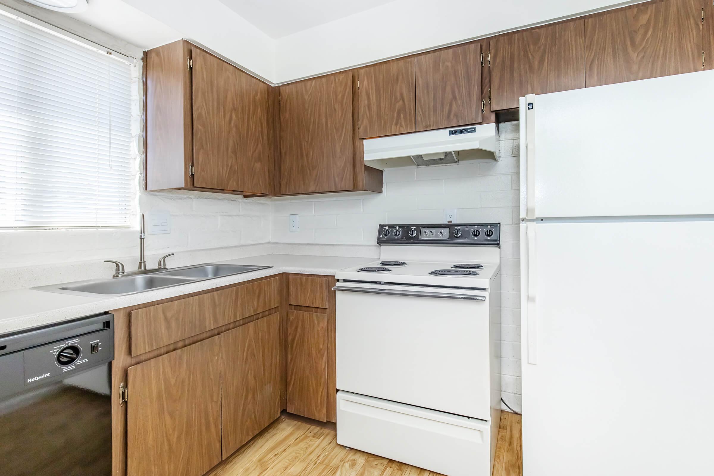 a kitchen with a stove top oven sitting inside of a refrigerator