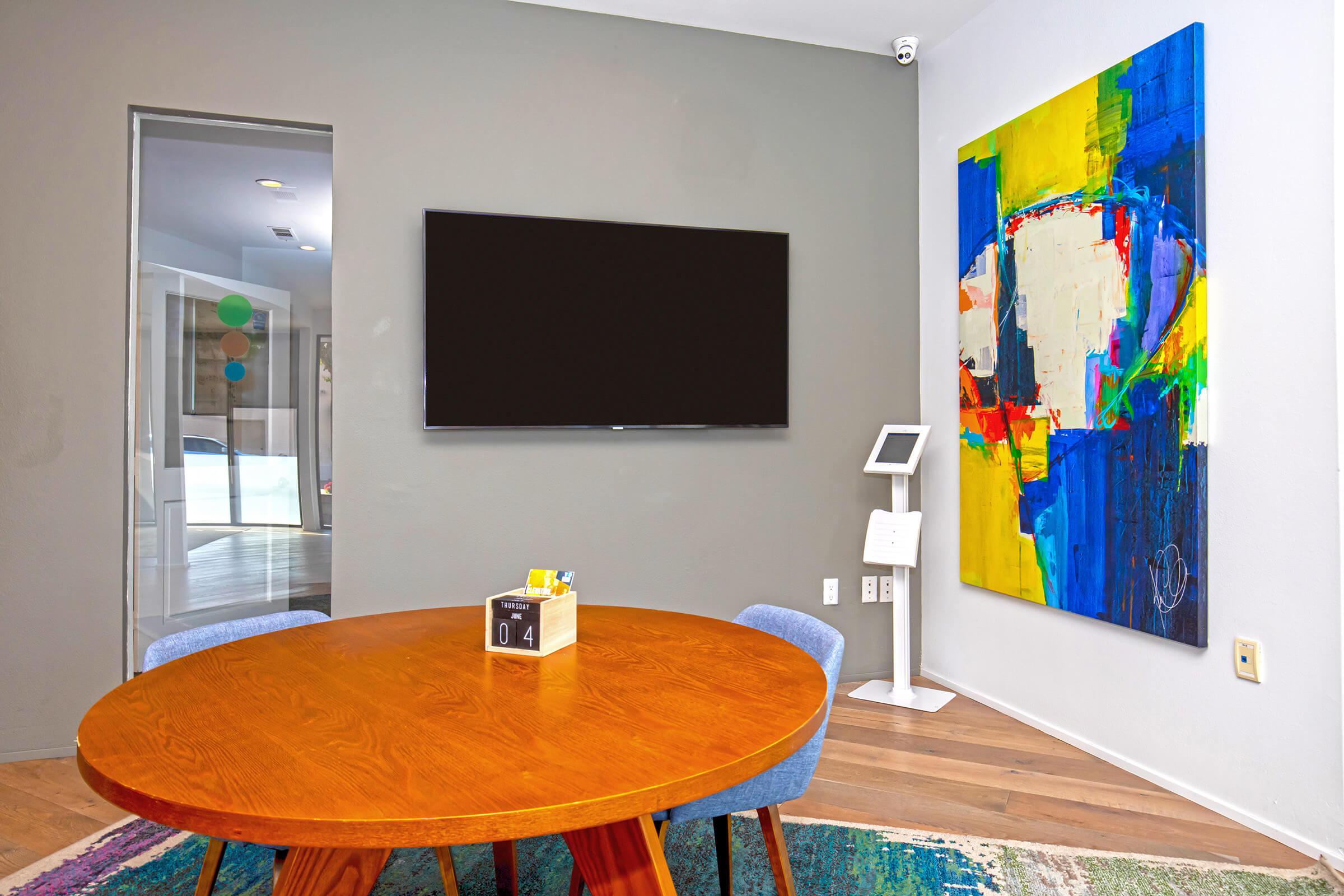 a living room with a tv on a table