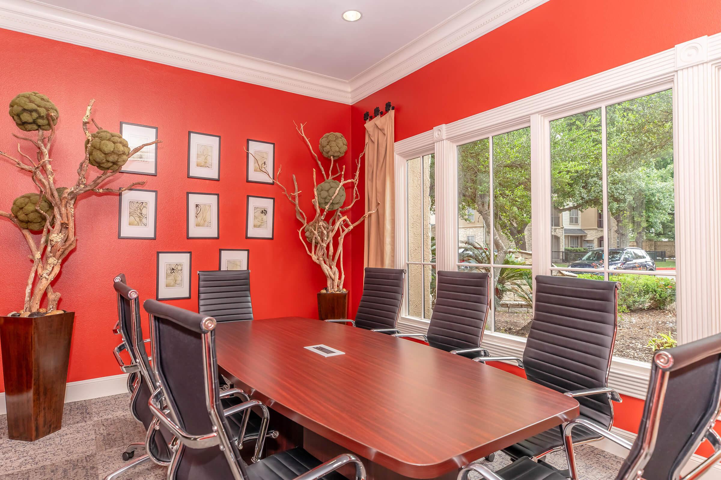 a dining room table in front of a window