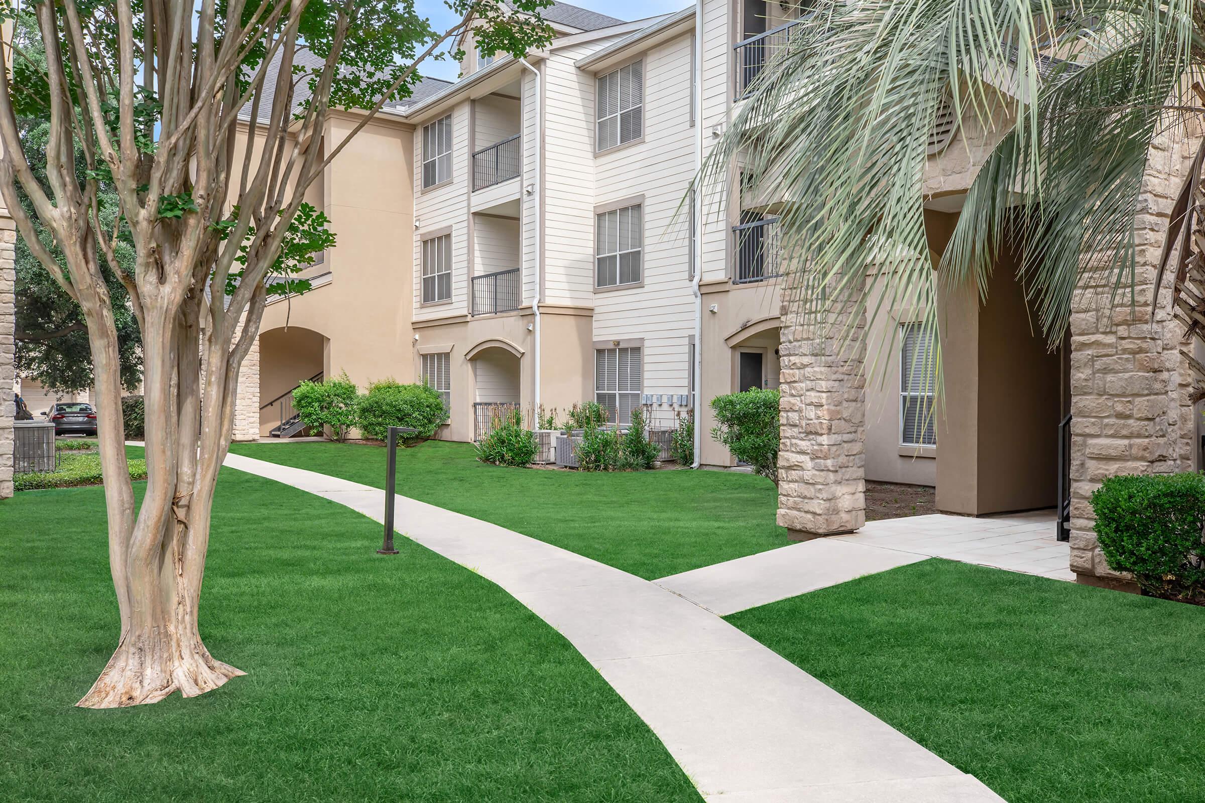 a large lawn in front of a building