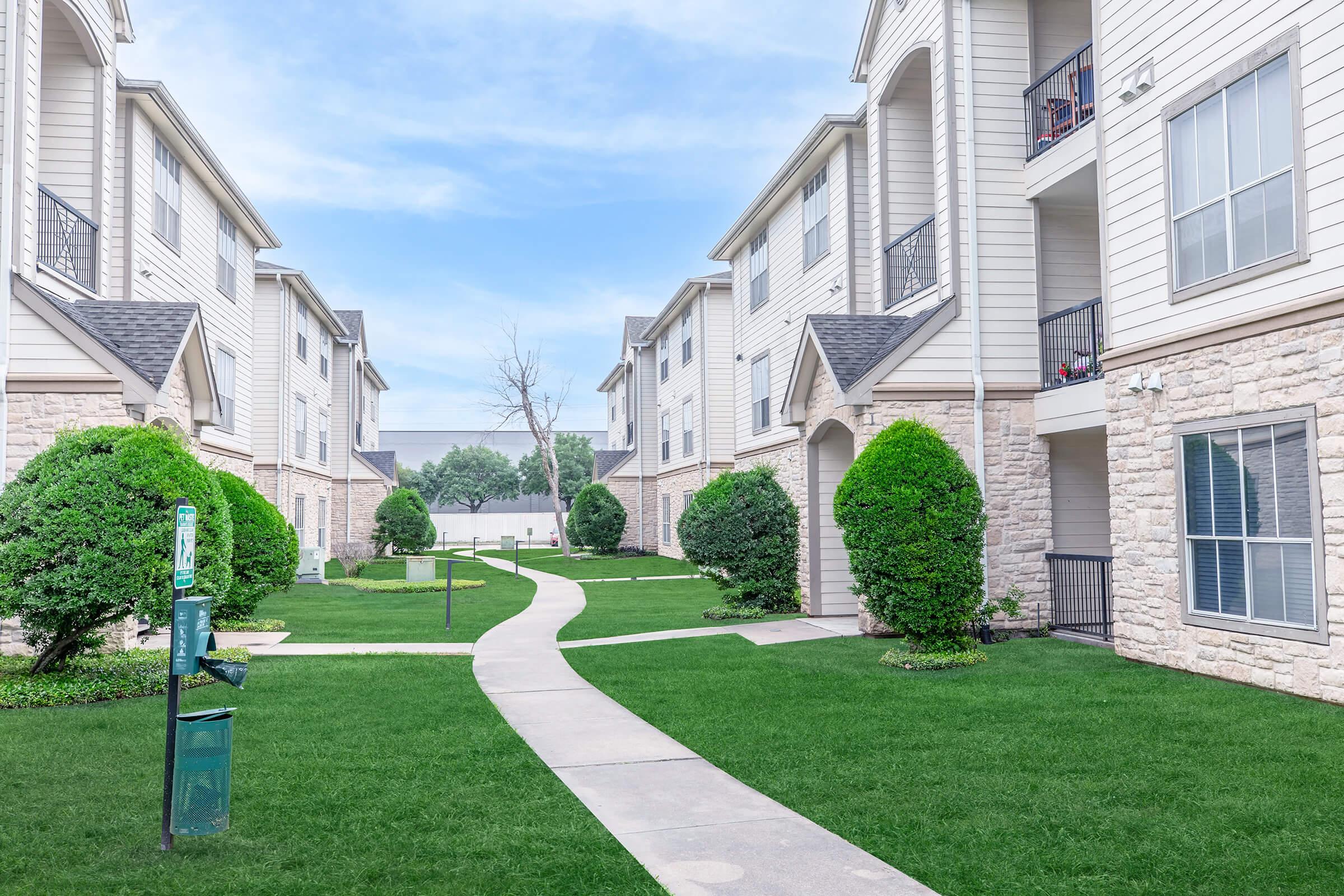 a large lawn in front of a building