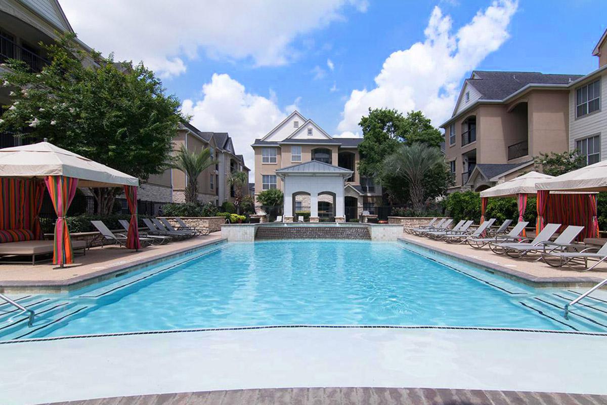 a house with a large pool of water