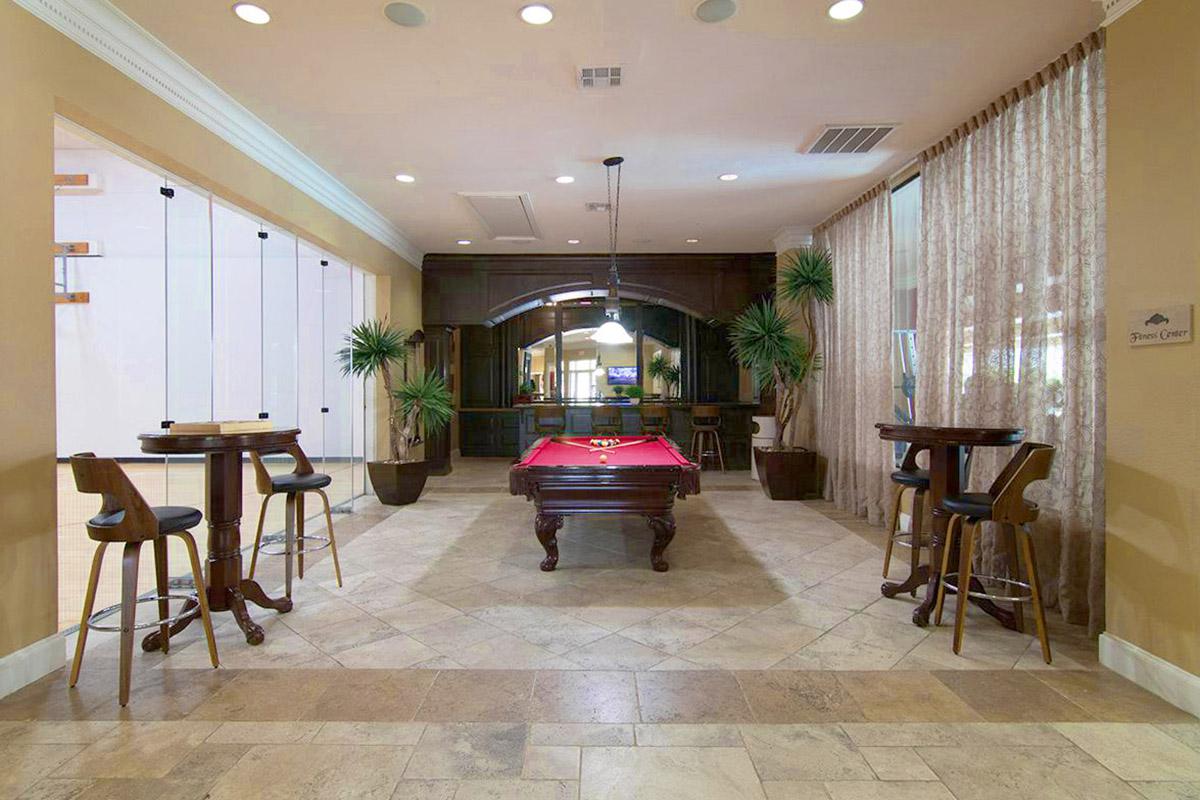 a living room filled with furniture and a large window