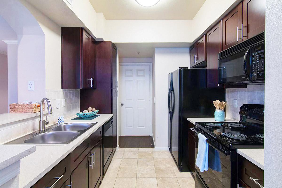 a modern kitchen with stainless steel appliances