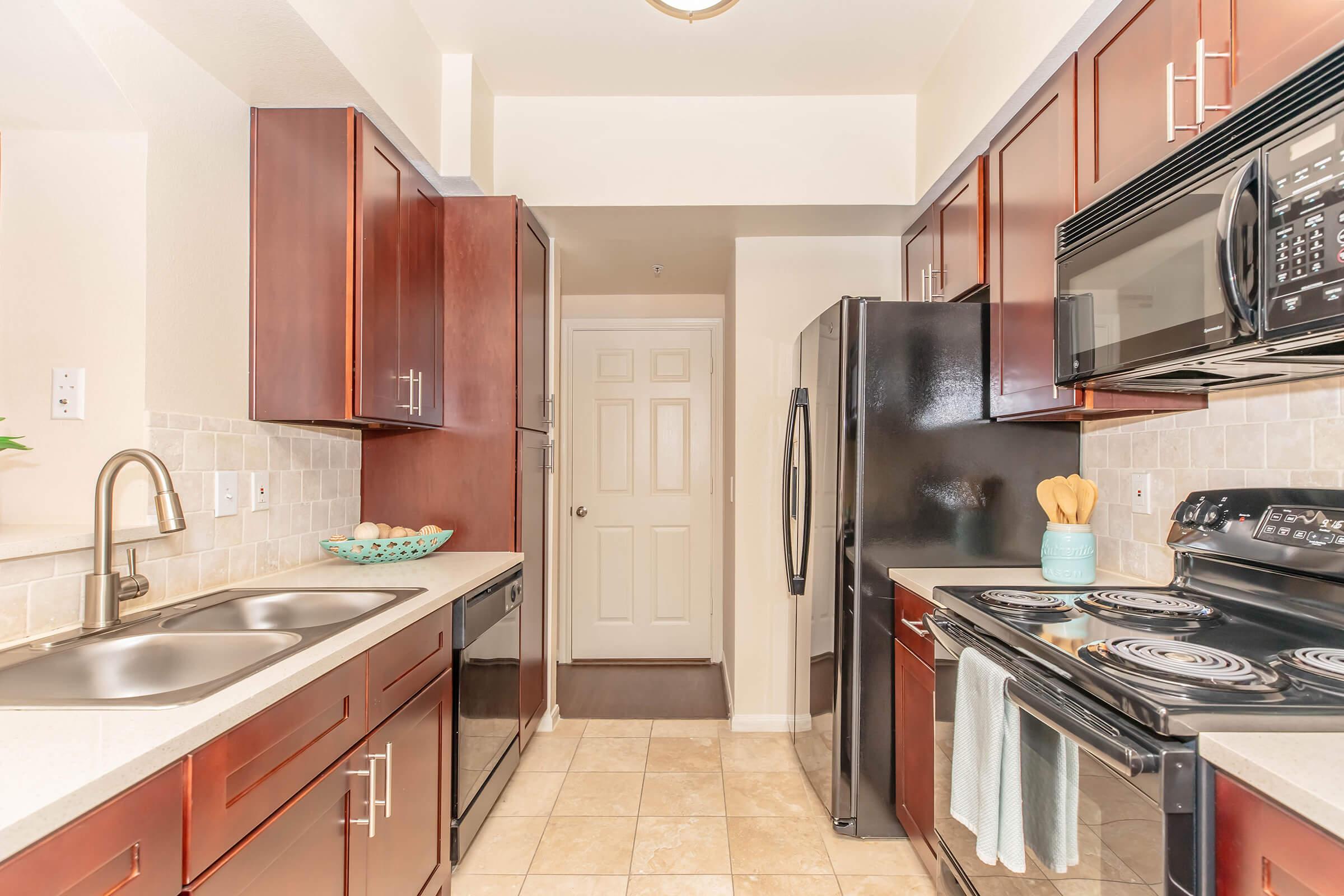 a modern kitchen with stainless steel appliances