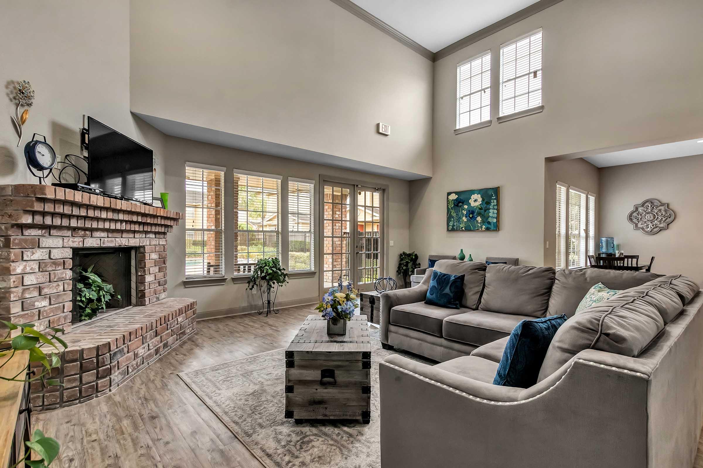 a living room filled with furniture and a fireplace