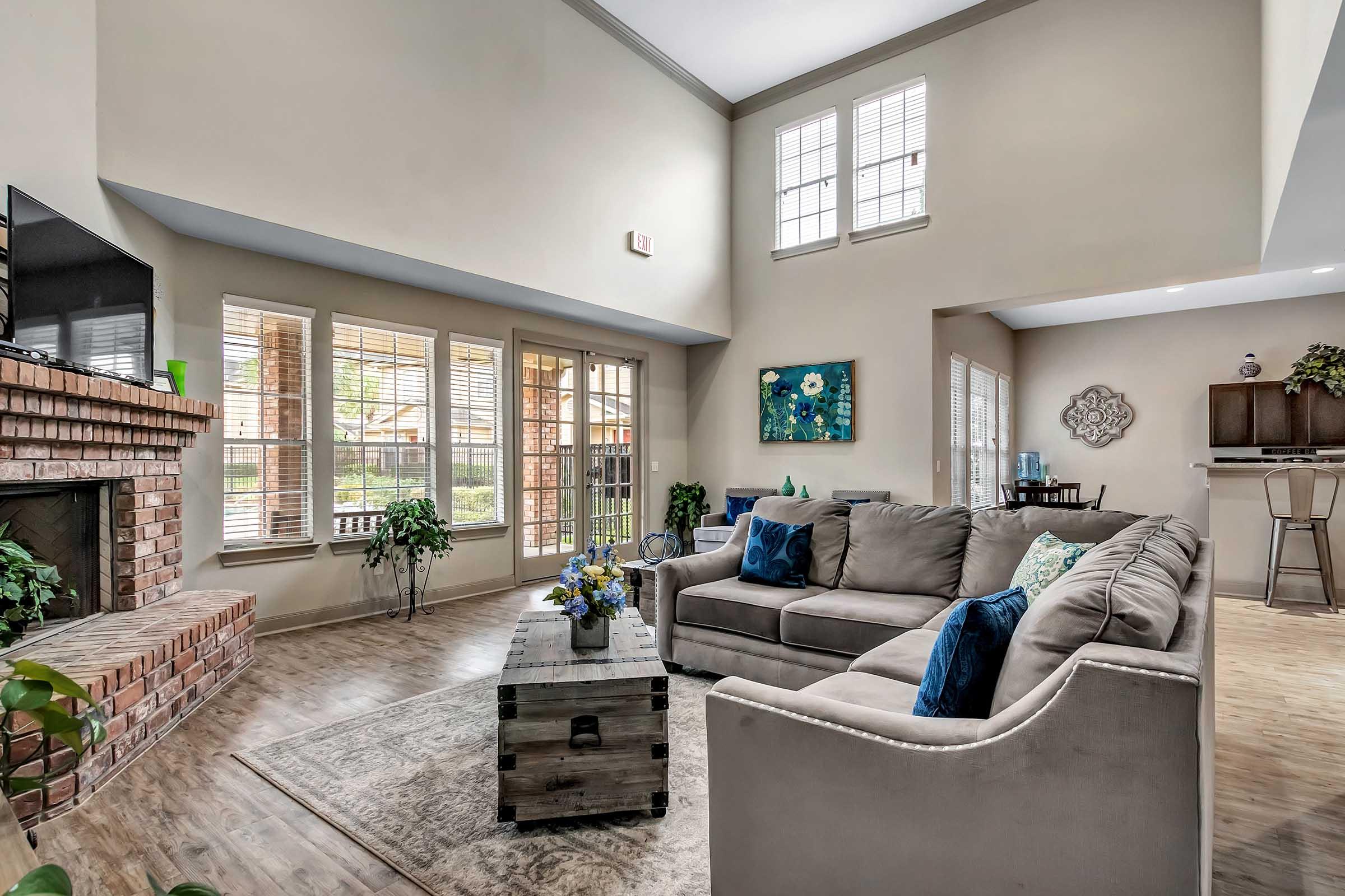 a living room filled with furniture and a fire place