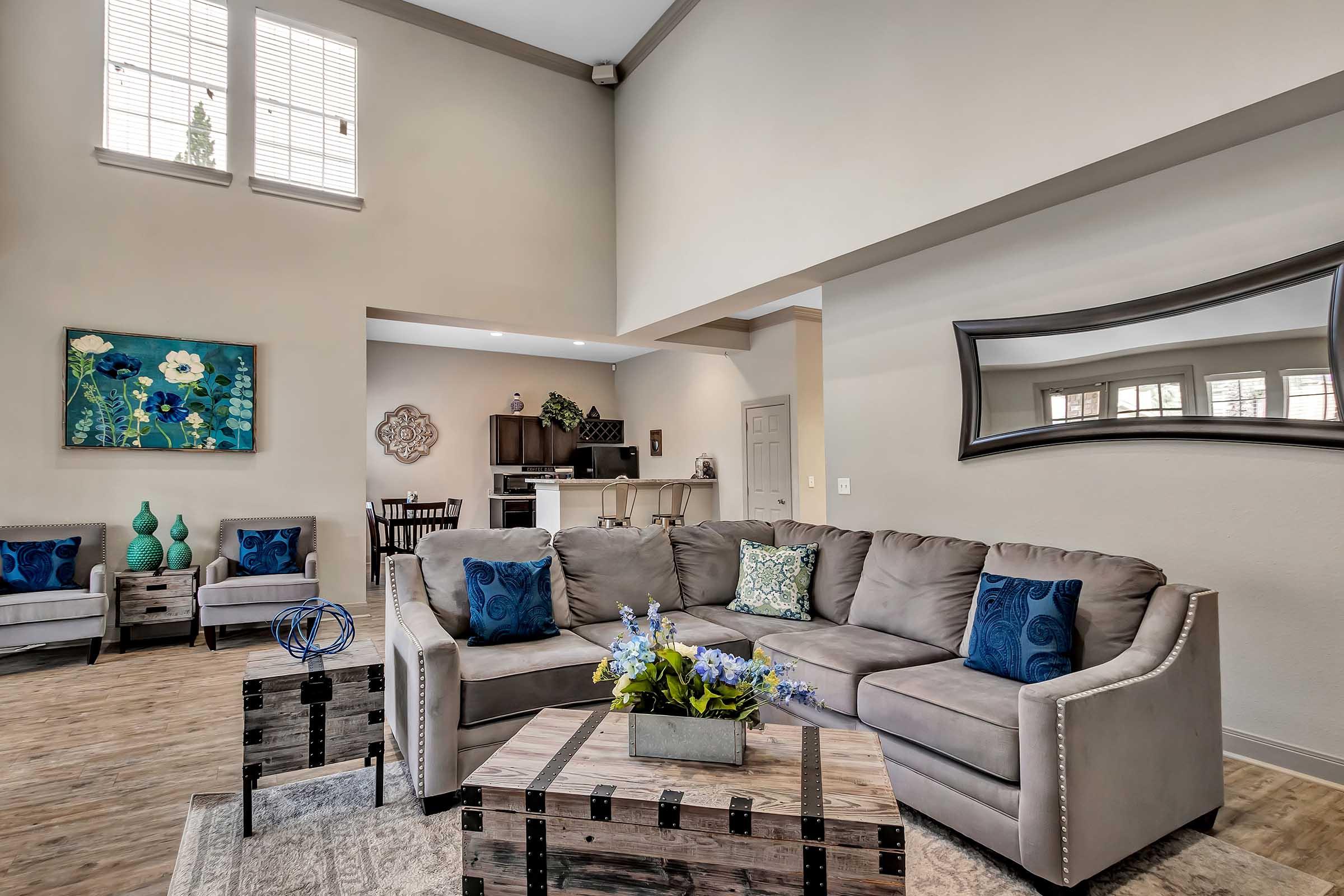 a living room filled with furniture and a window